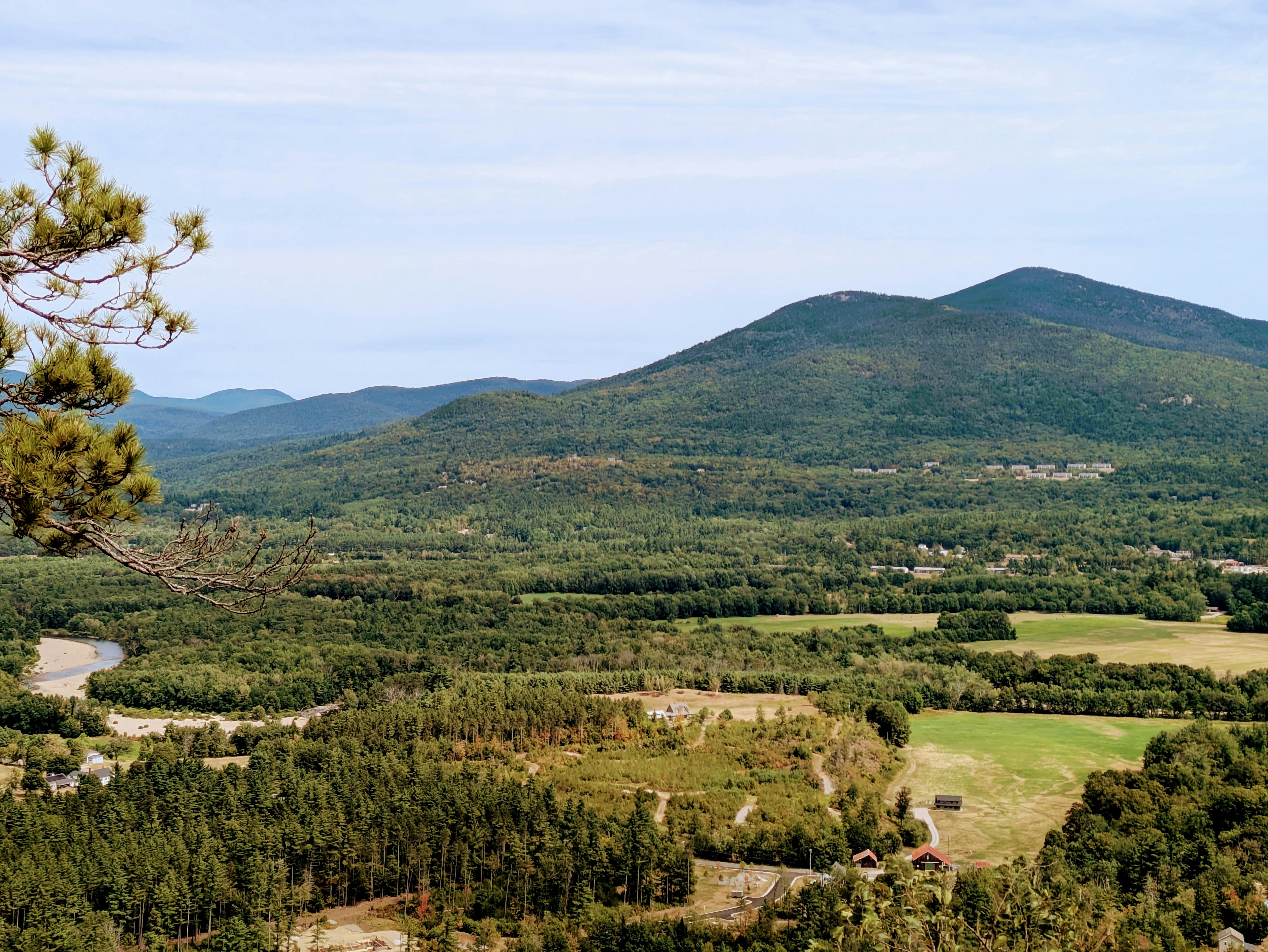 Lush green valley with rolling hills and trees - local backlinks New Hampshire