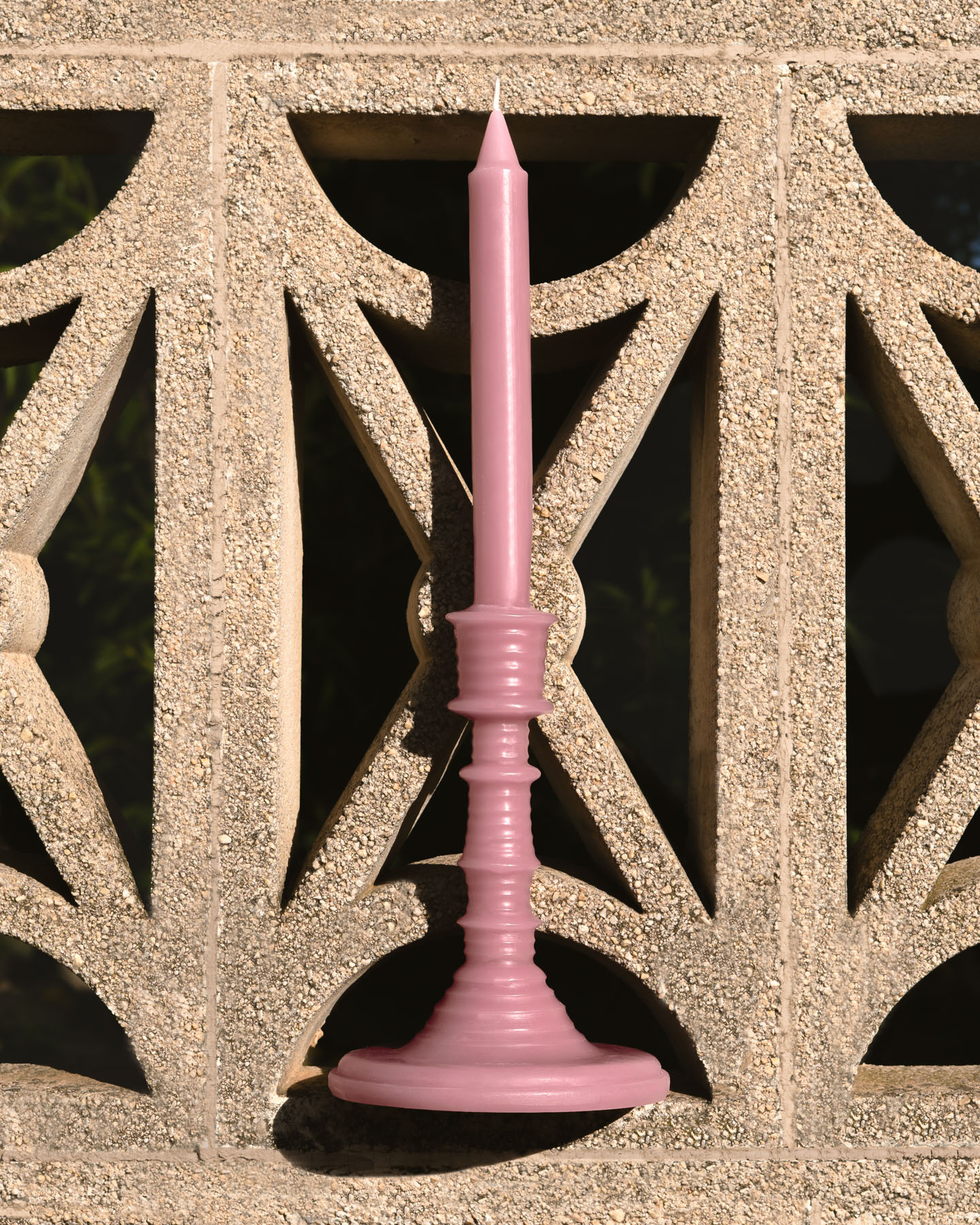 Ivy LOEWE Wax Scented Candleholder photographed against traditional Mediterranean architectural details.