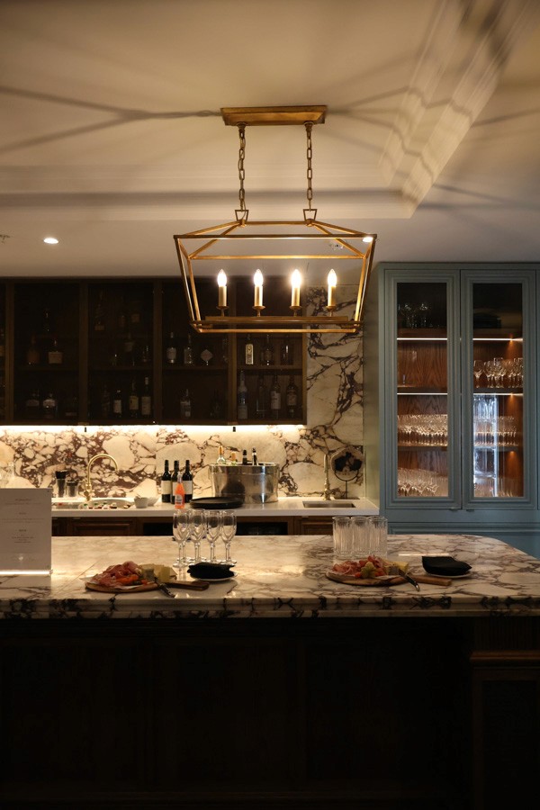 bartending area, wine glasses, and food