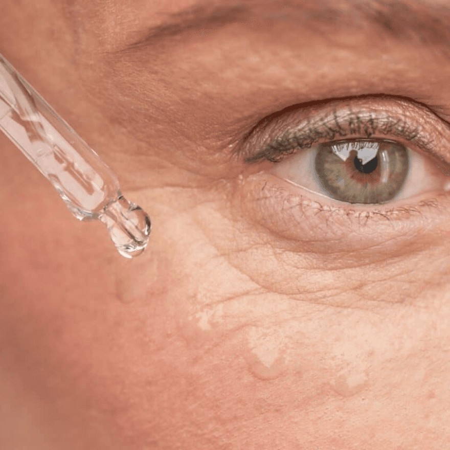 A woman apliying serum