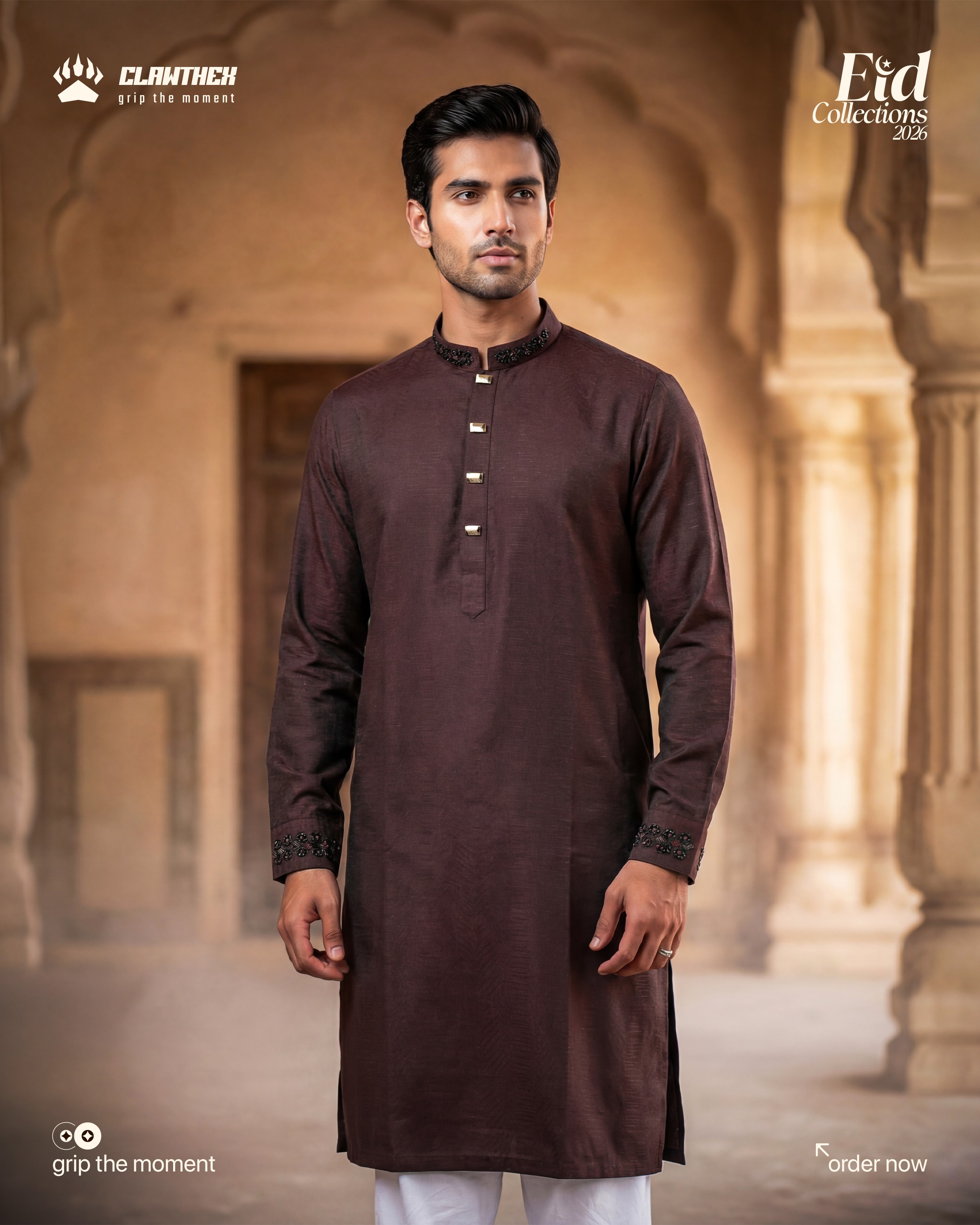 a man with a beard and glasses standing in front of a lamp