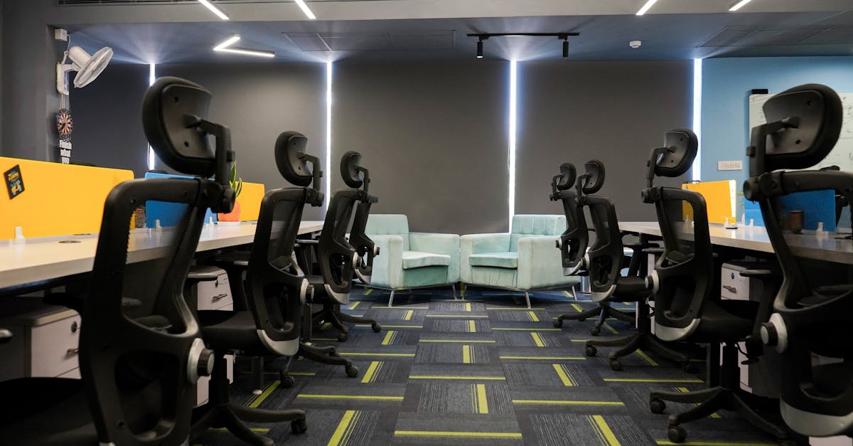 Spacious modern office with ergonomic chairs and bright decor, perfect for a productive work environ