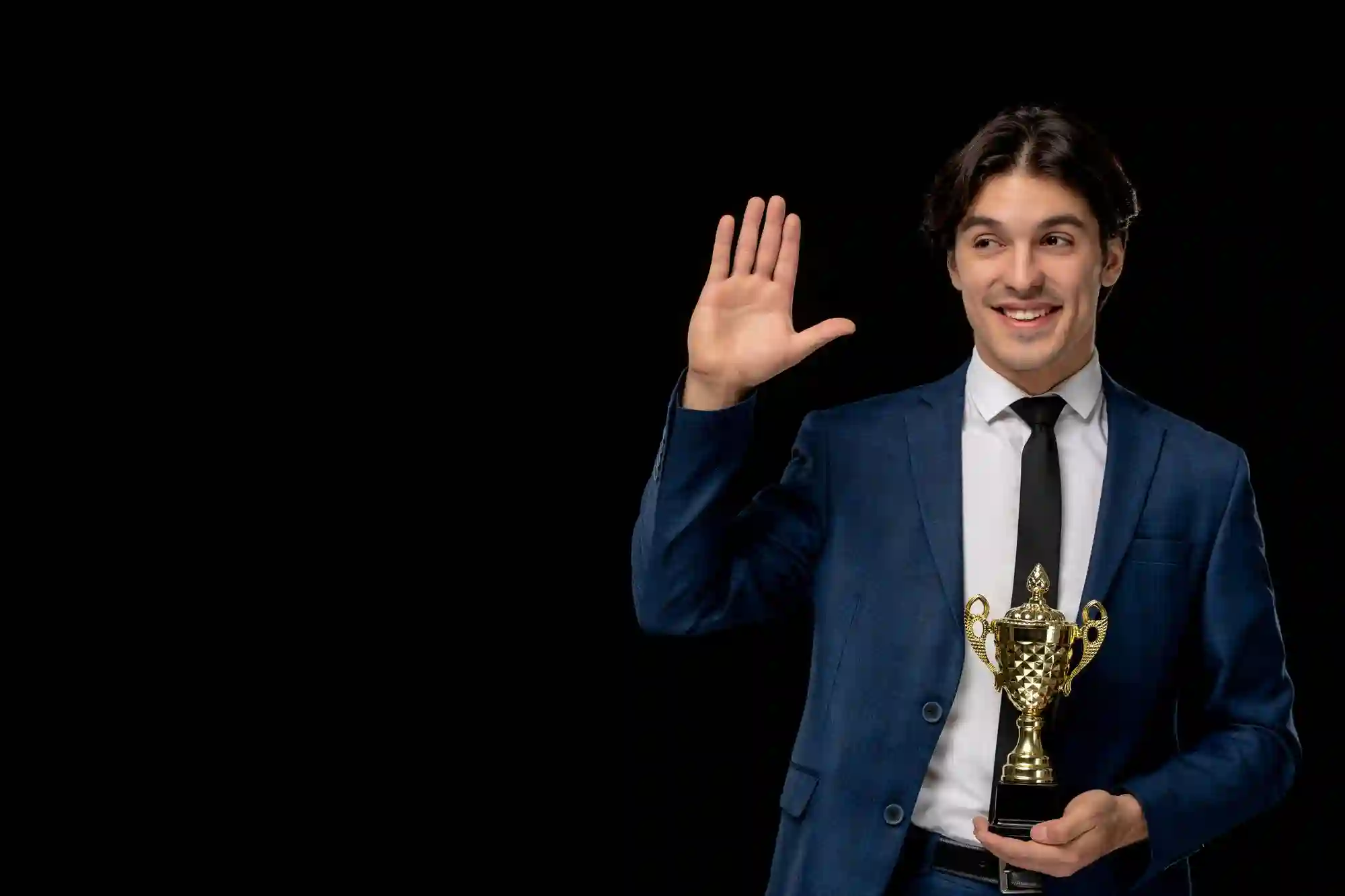 A businessman in a blue suit holds a gold trophy, symbolizing professional achievement, excellence, and corporate success