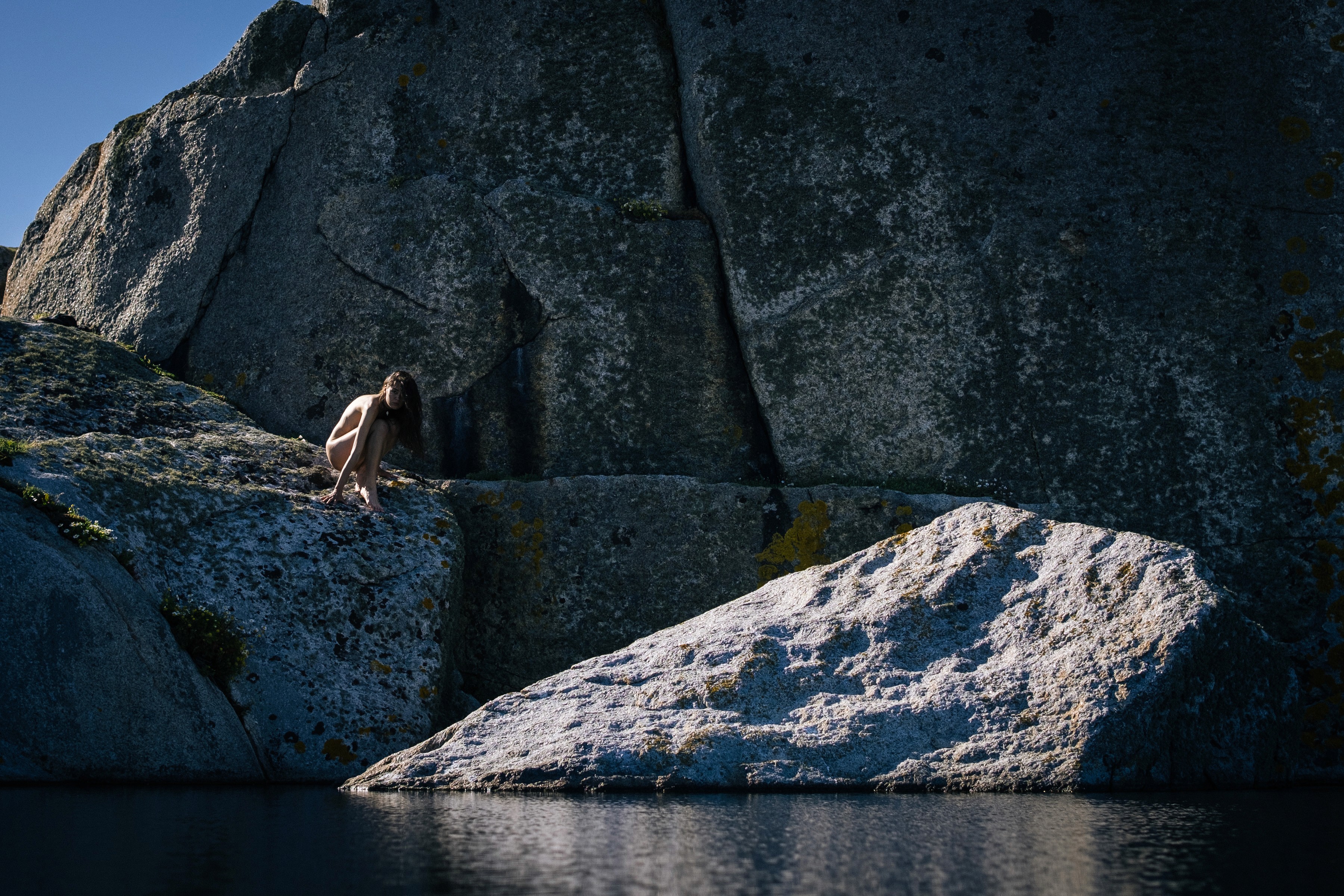 photo of a girl on a rock