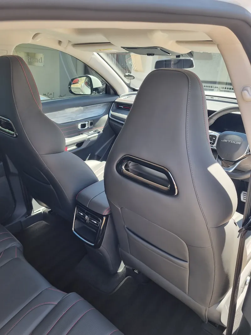 Back view of the interior of a car showing the leather seats