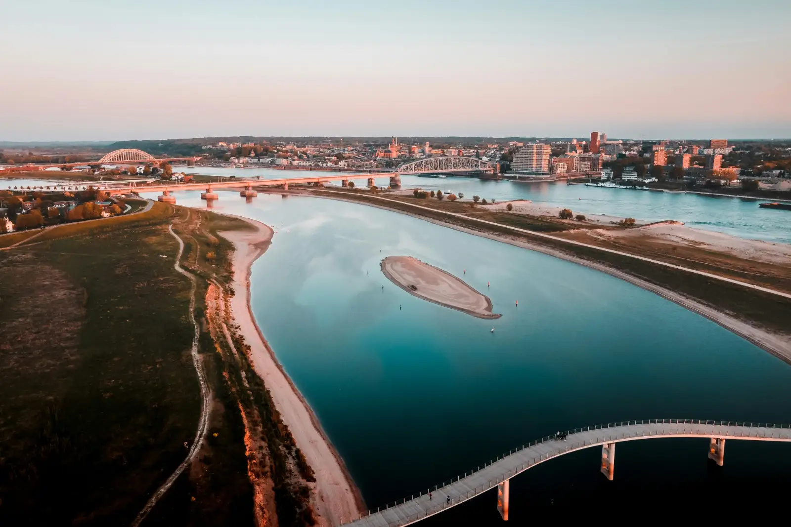 aerial-view-of-city-buildings-near-body-of-water-during-daytime
