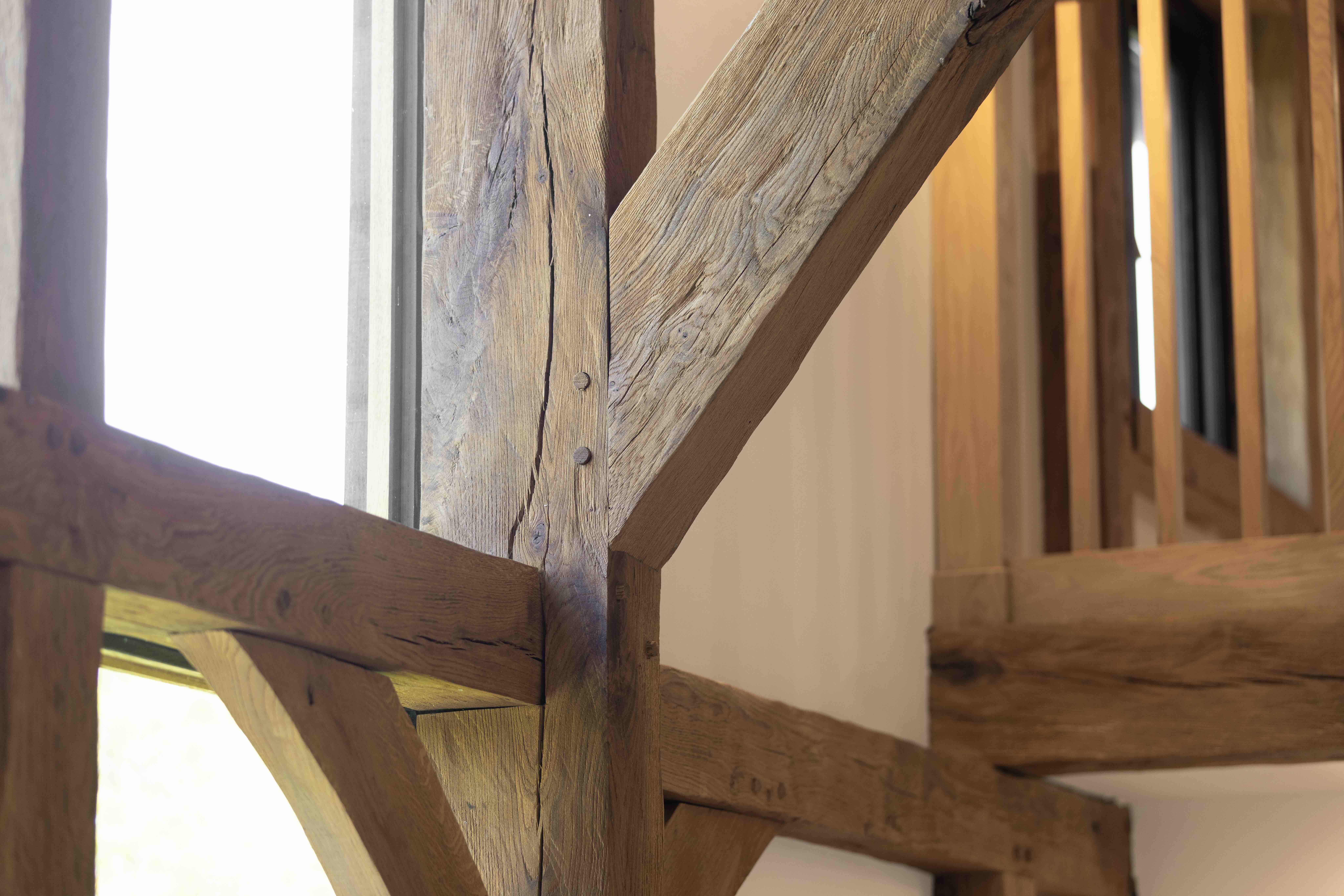     External view of oak-framed barn reconstruction, re-establishing the character of a historic agricultural building in Oxfordshire
