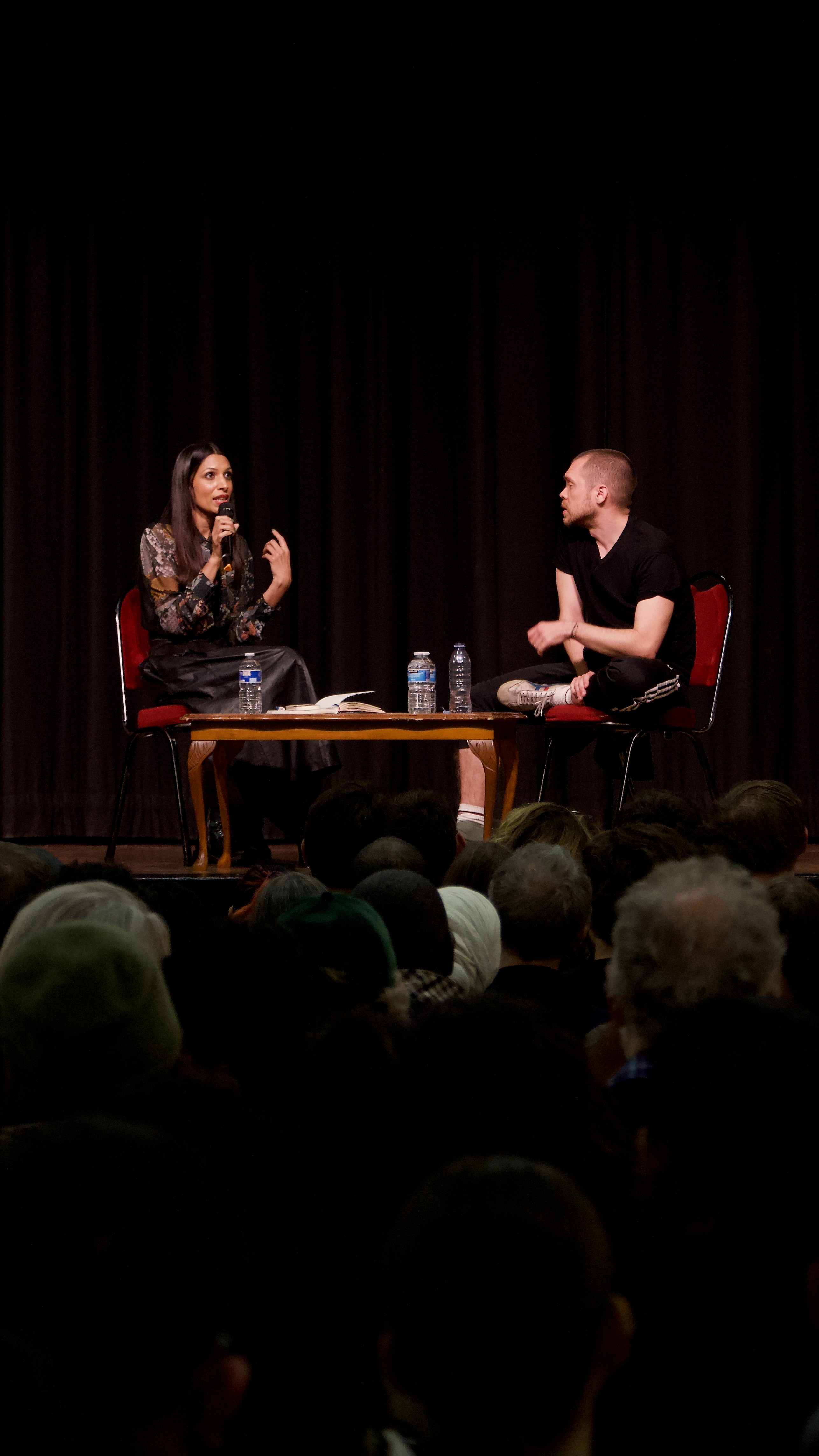 Faiza Shaheen in conversation with Gary Stephenson on stage at an event.