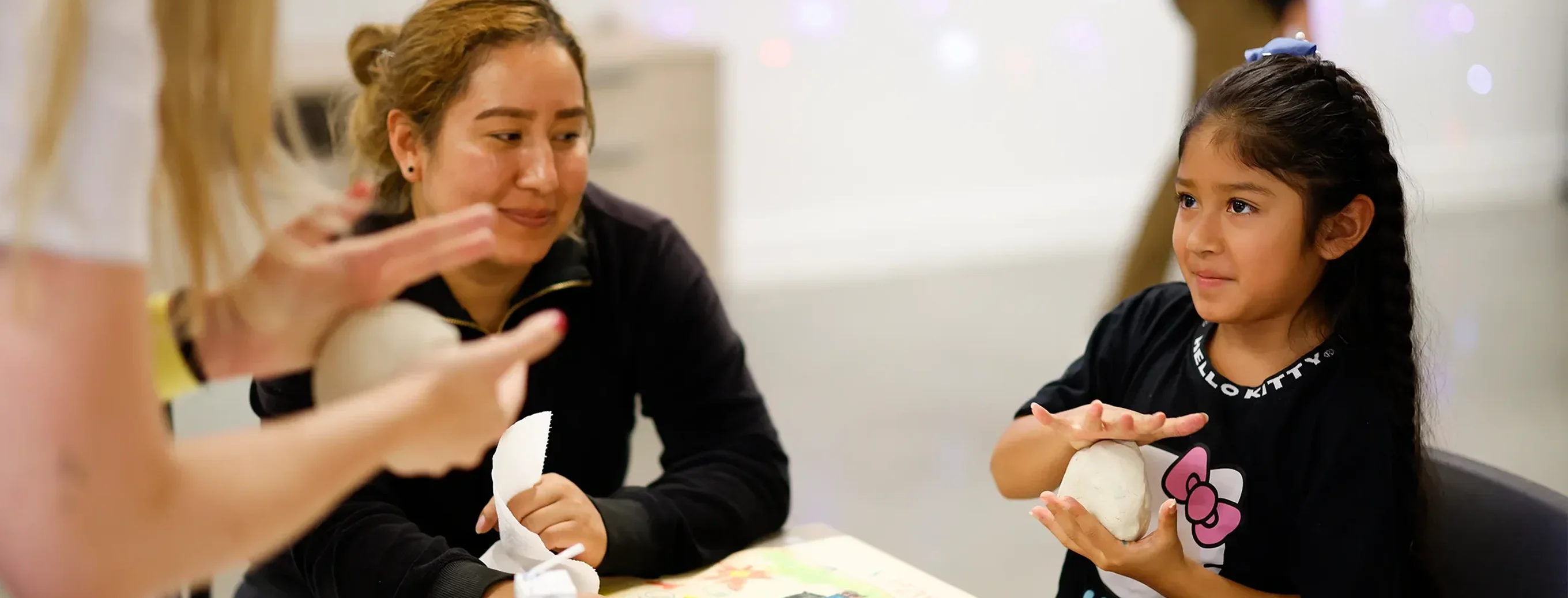 A child learning to mold with clay