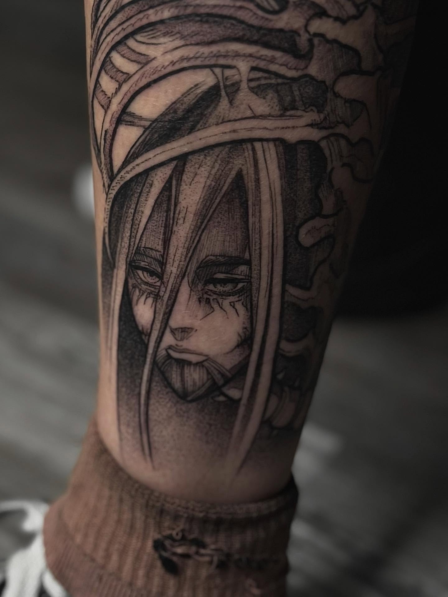 A grayscale anime-style tattoo of a character with spiky hair and a headband, holding a kunai.  The tattoo is on someone's forearm.