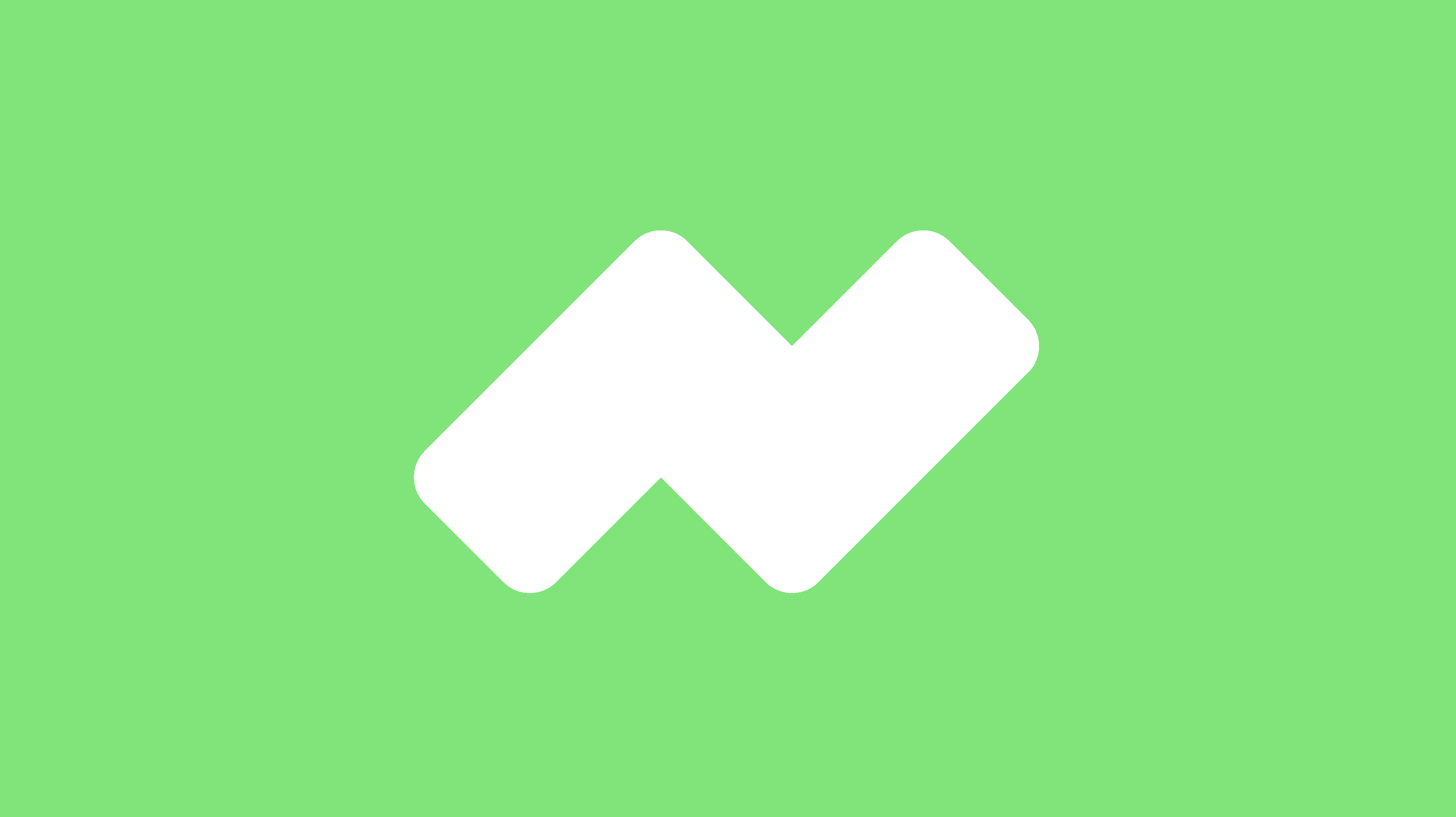 Modern home office setup with a monitor, ergonomic chair, keyboard, and indoor plants near a window with blinds.