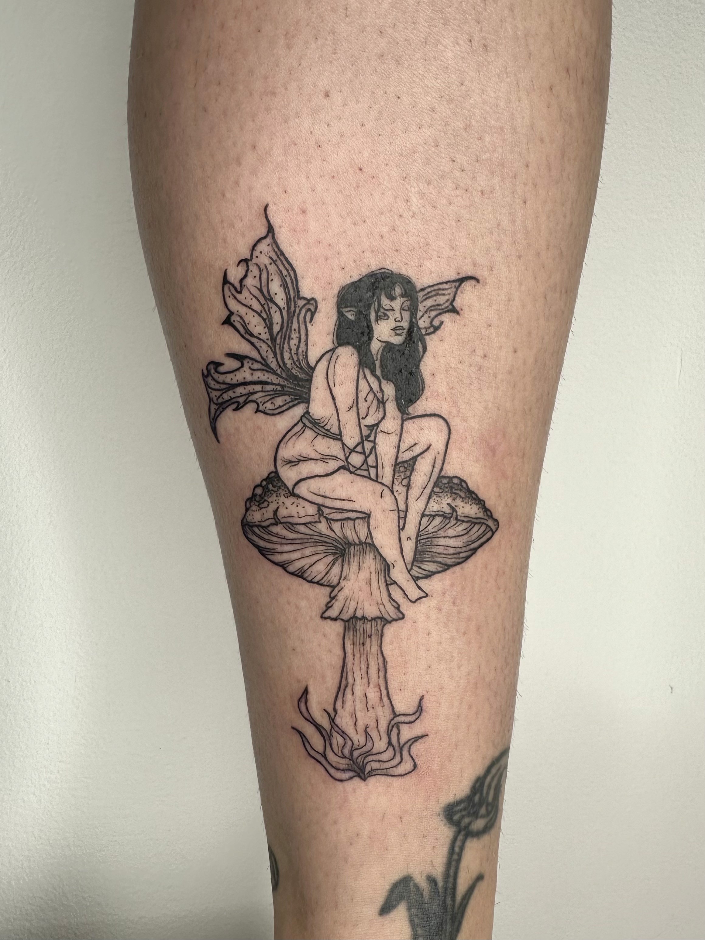 Playful Graphic Linework Fairy Tattoo by Artist Sandra