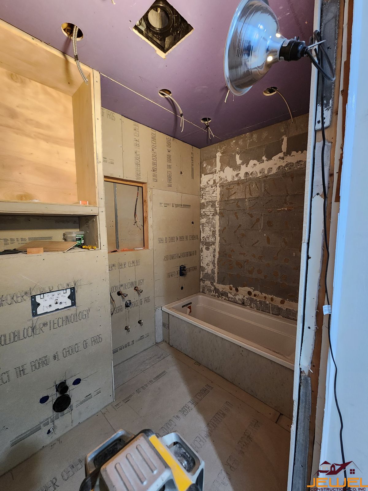 Custom Trex composite deck finished ceiling using Trex Rain Escape by Jewel Construction in Queens, NYC