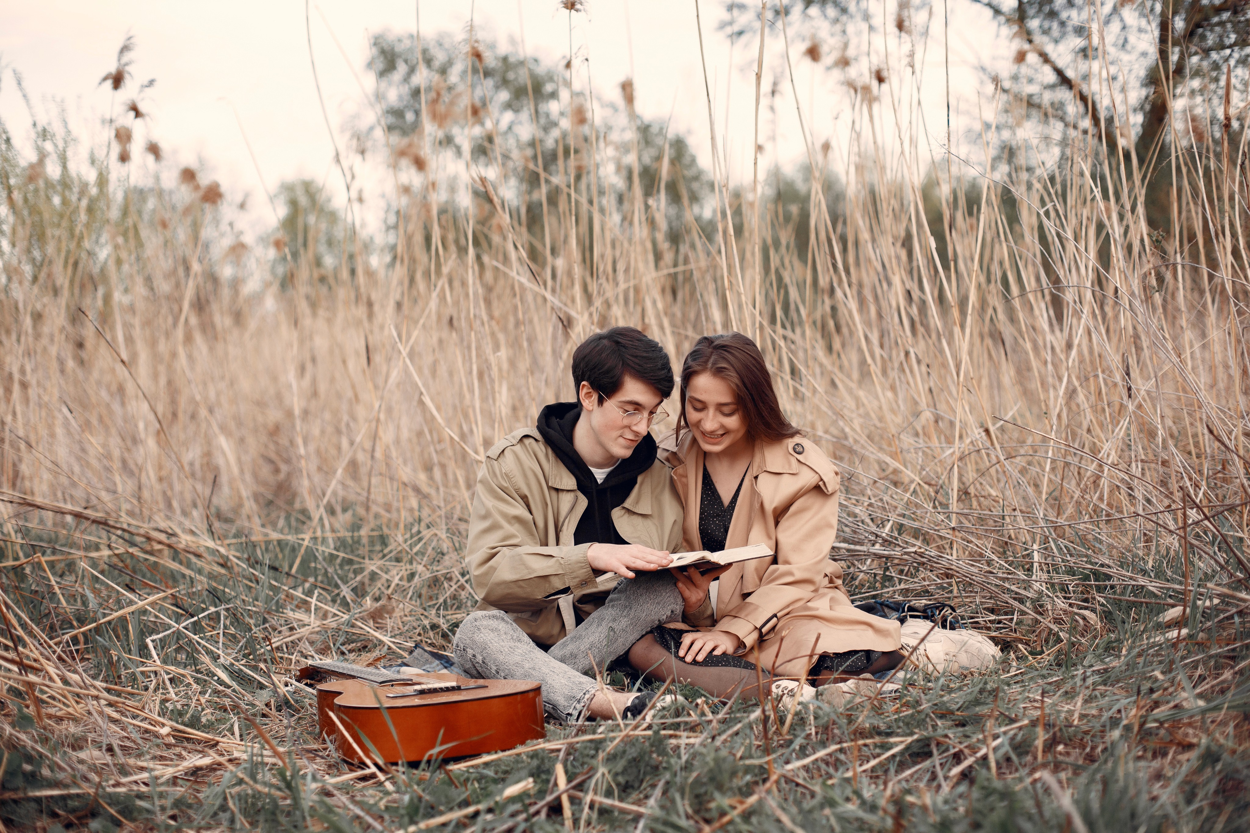 Couple are reading book with smile face