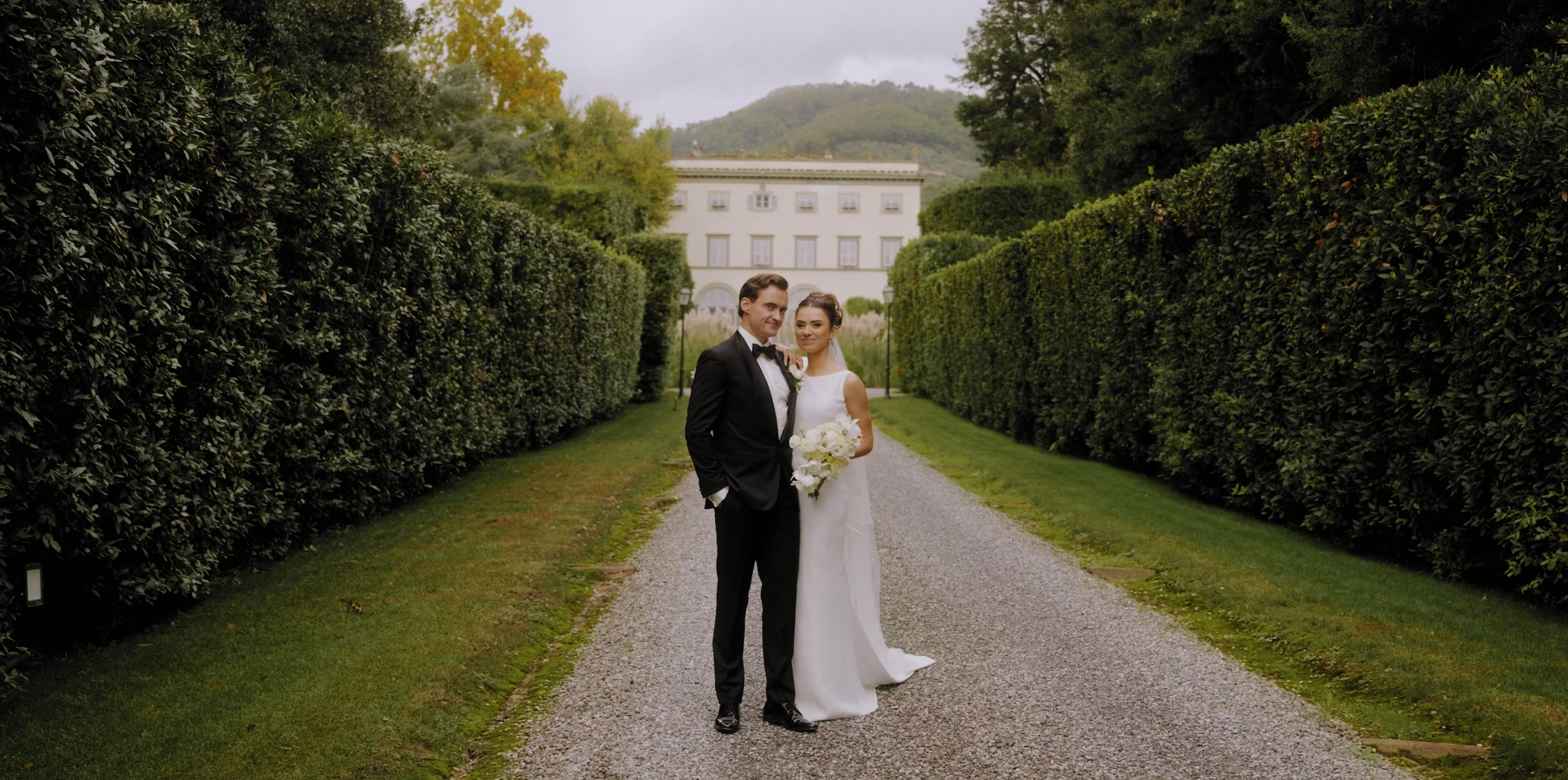 Eoghan and Dominyka on the garden avenue of Villa Grabau, Lucca, Italy.