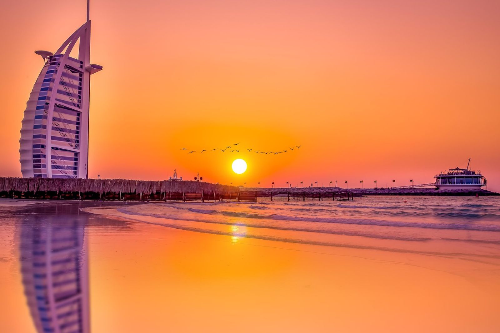 The Sunset Beach in Dubai, with calm waves and a view of the Burj Al Arab.
