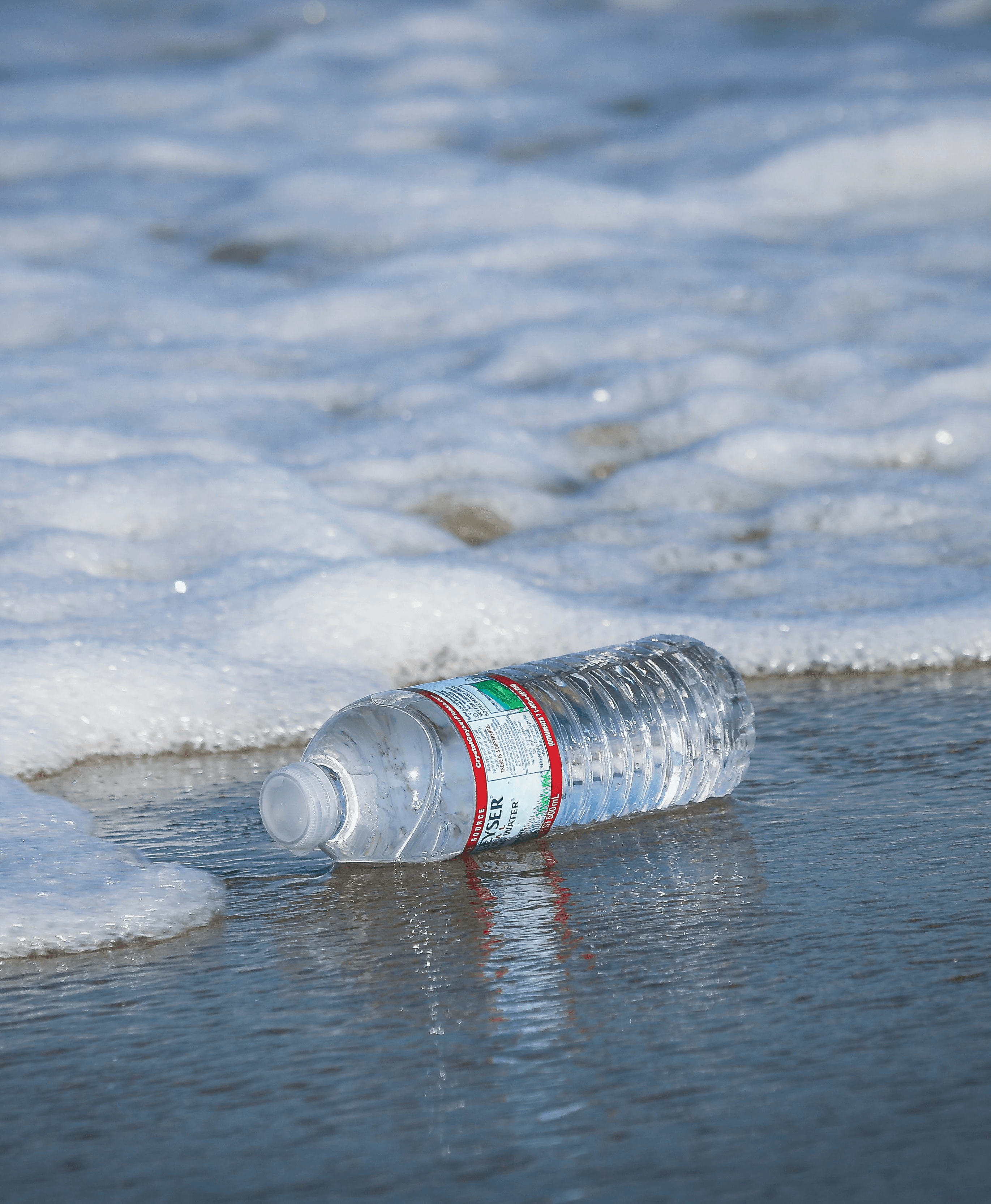 water plastic bottle on seashore