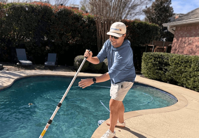 Plano pool being cleaned by technician from Poolside, TX pool service