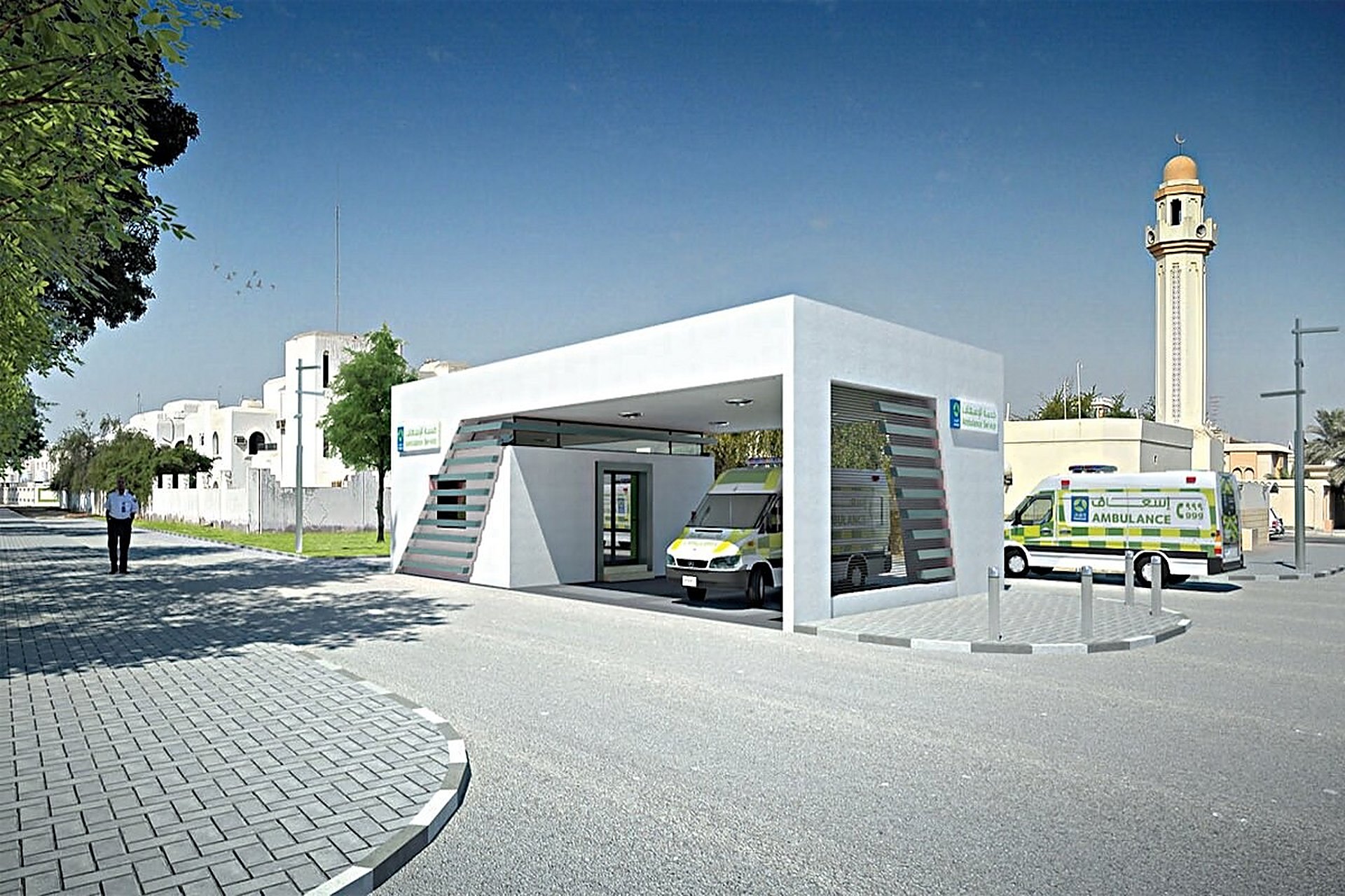Une zone d'attente d'ambulances de Hamad Medical Corporation à Doha, un bloc blanc moderne avec deux ambulances jaune et vert garées sous l'auvent