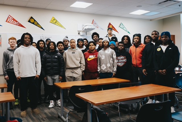 woman in gray hijab and gray coat