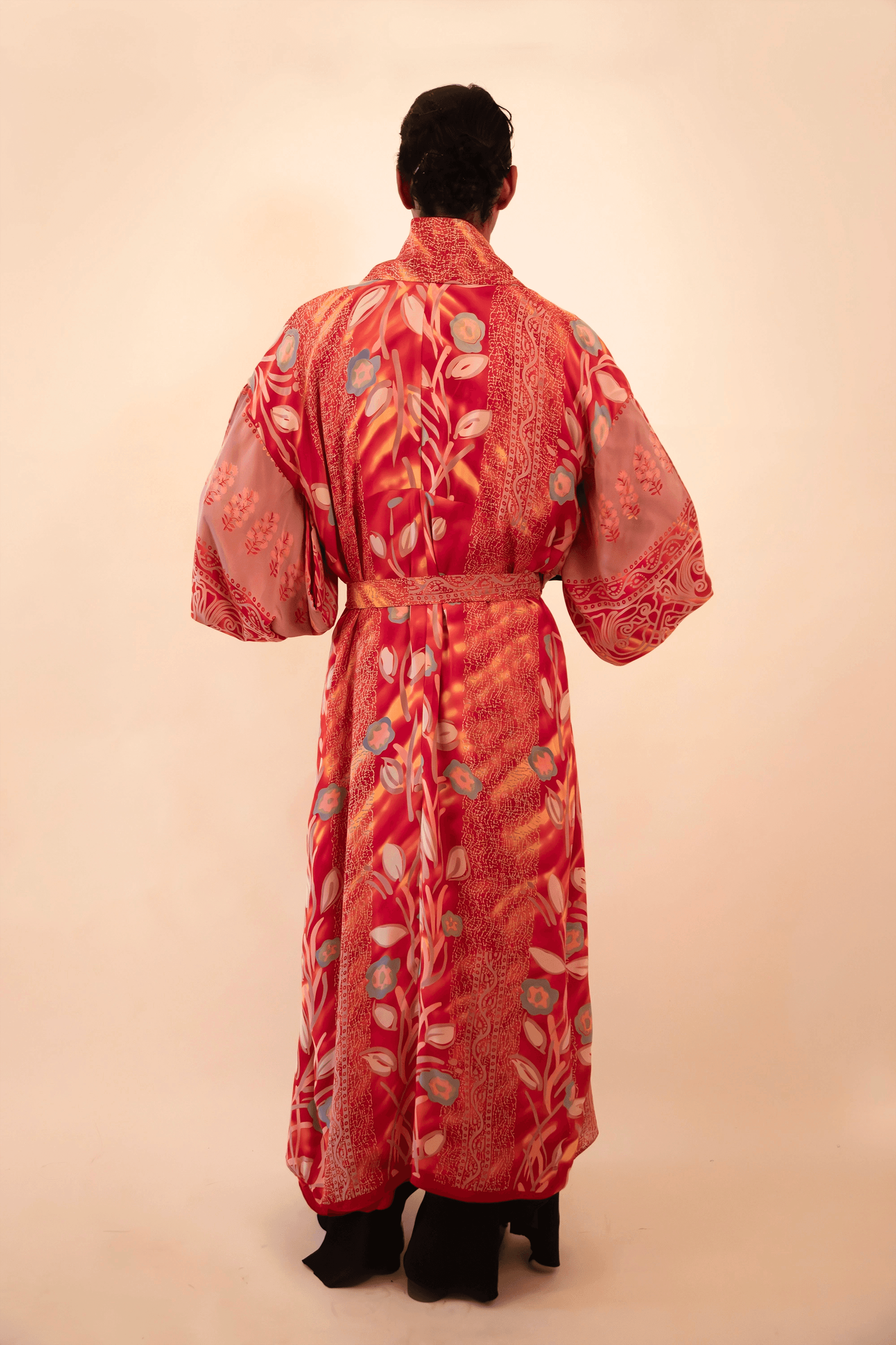 Lalita is our one-of-a-kind red printed silk kimono, handcrafted by skilled artisans in-house using a vintage silk sari.