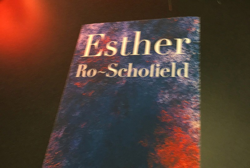 Esther Ro-Scholied poster with deep blue and bright red