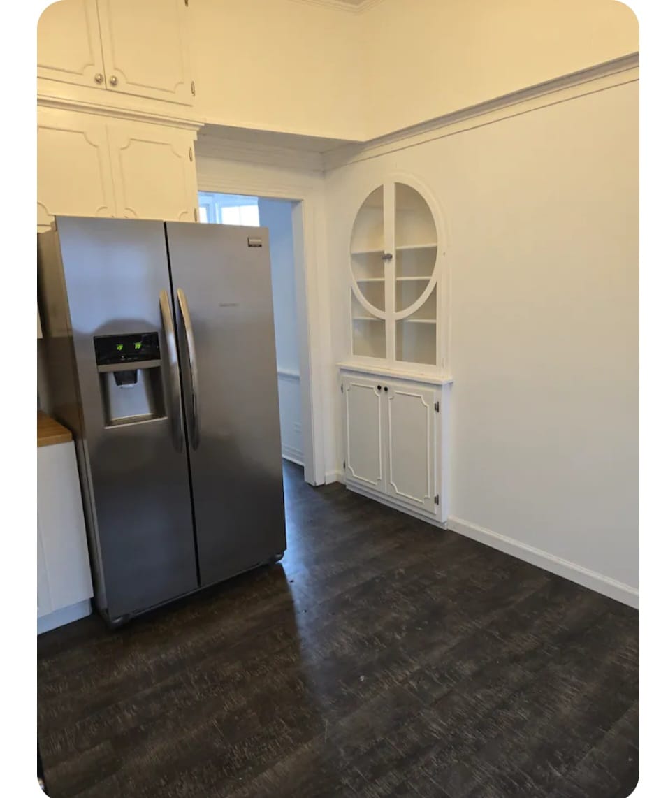 kitchen with two brown wooden chairs