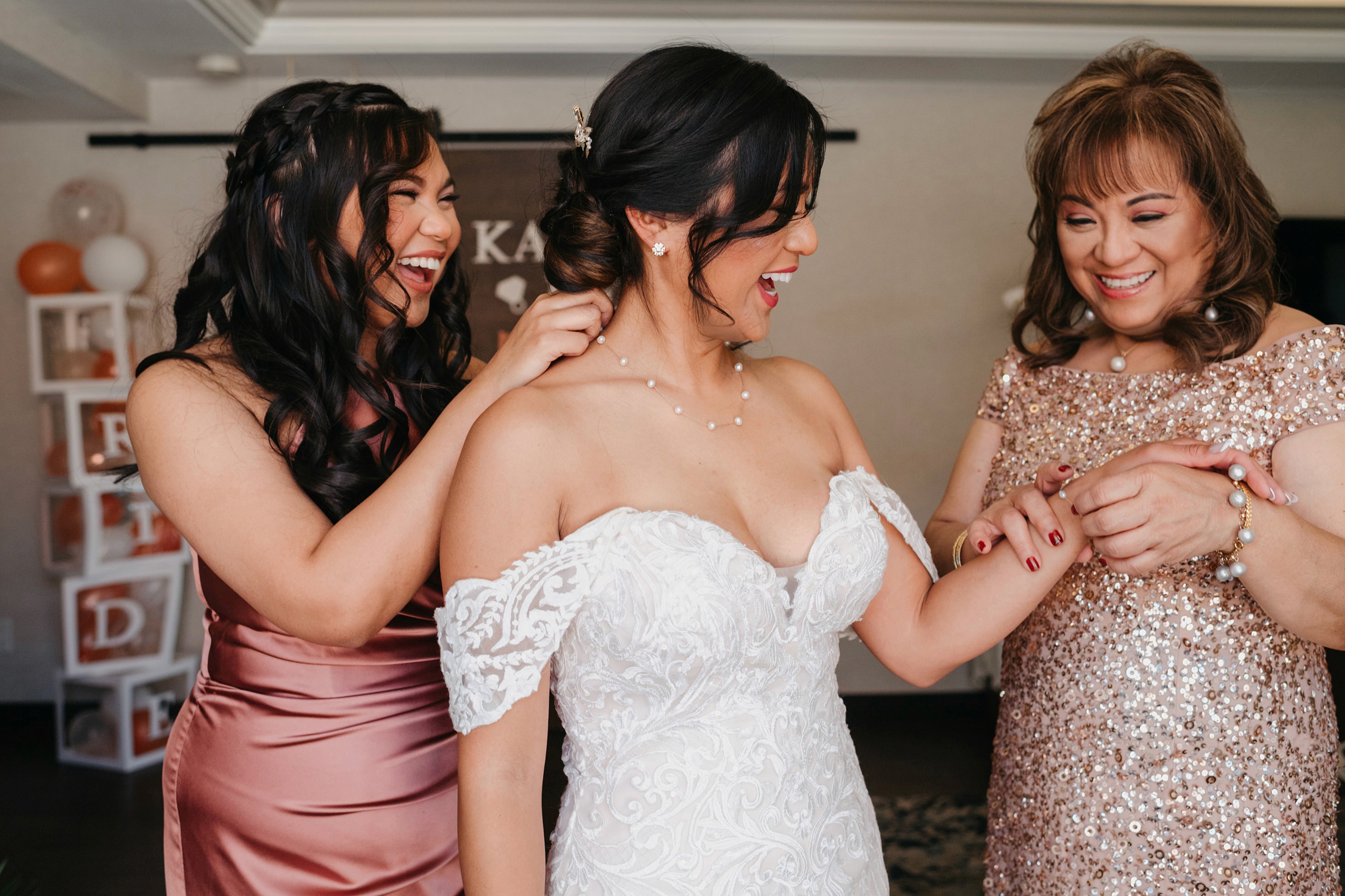 Bride getting final touches before leaving for the ceremony