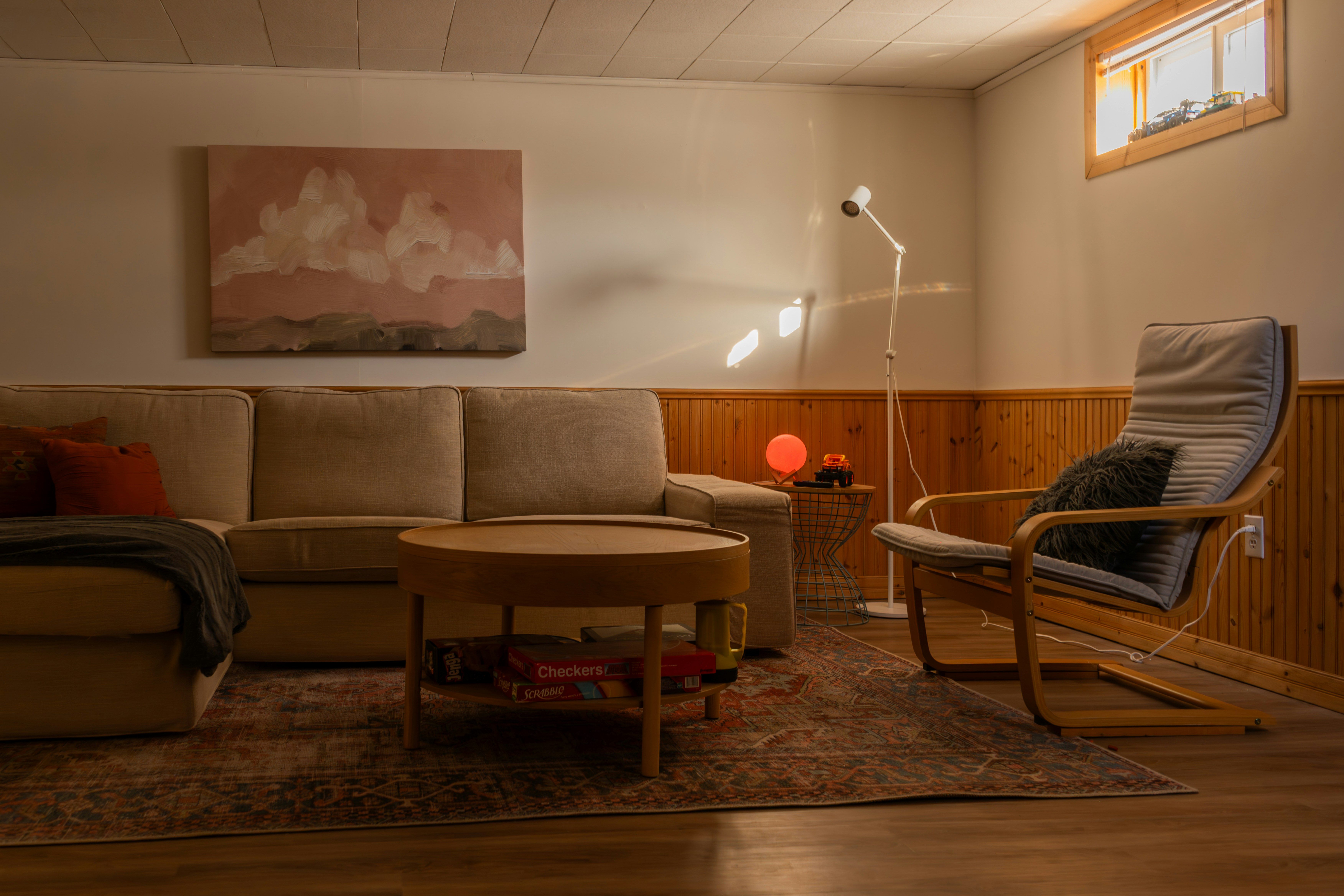 Cozy living room with sectional couch and armchair.