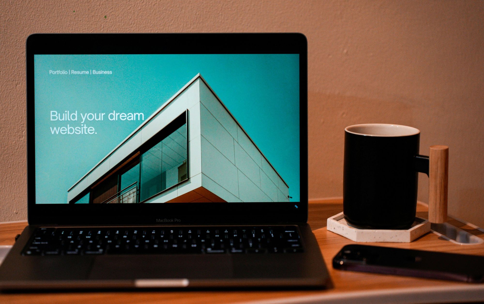 a picture of a computer and a coffee mug next to it