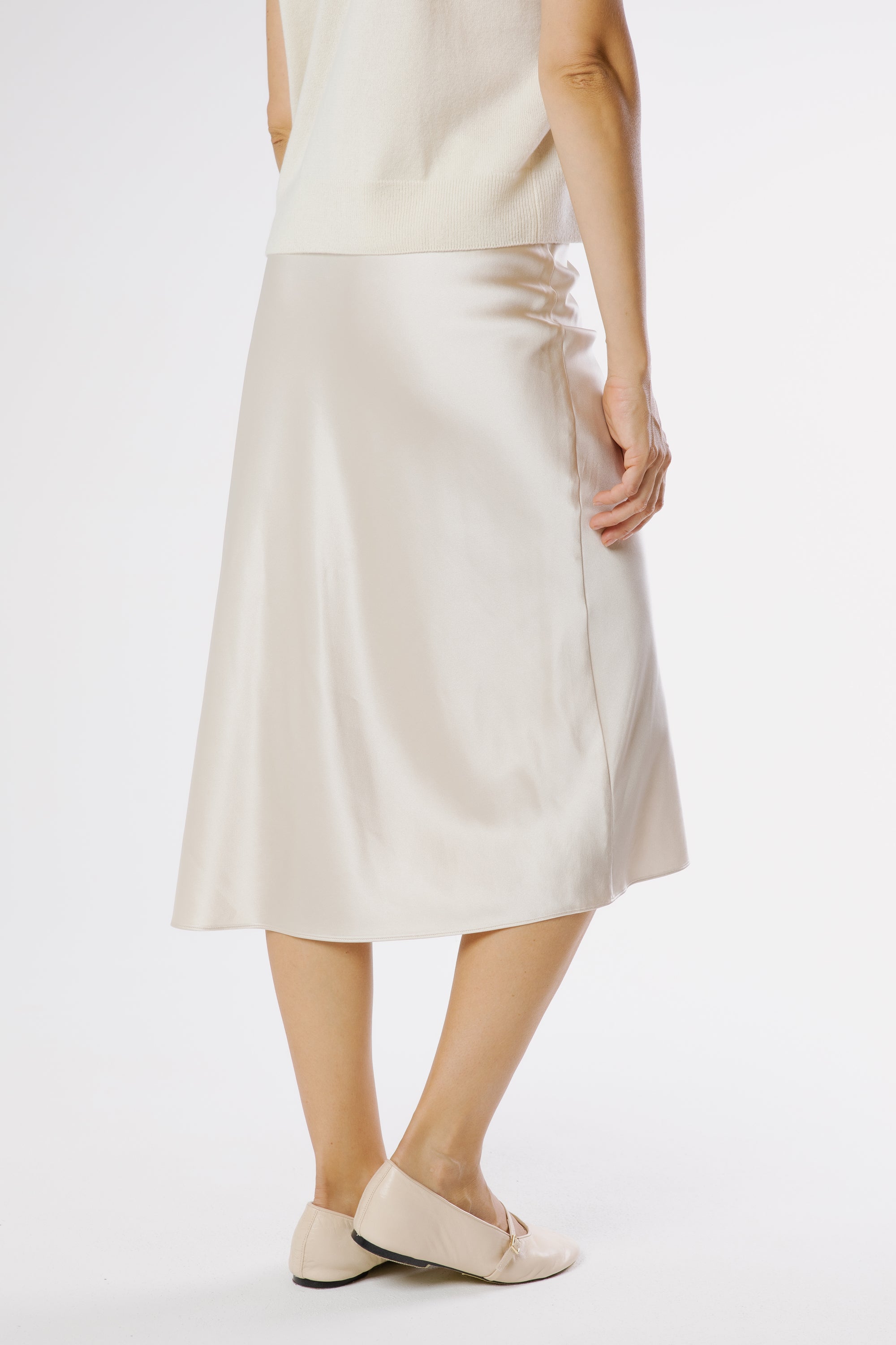 Champagne silk satin midi skirt back view, fluid elegant silhouette