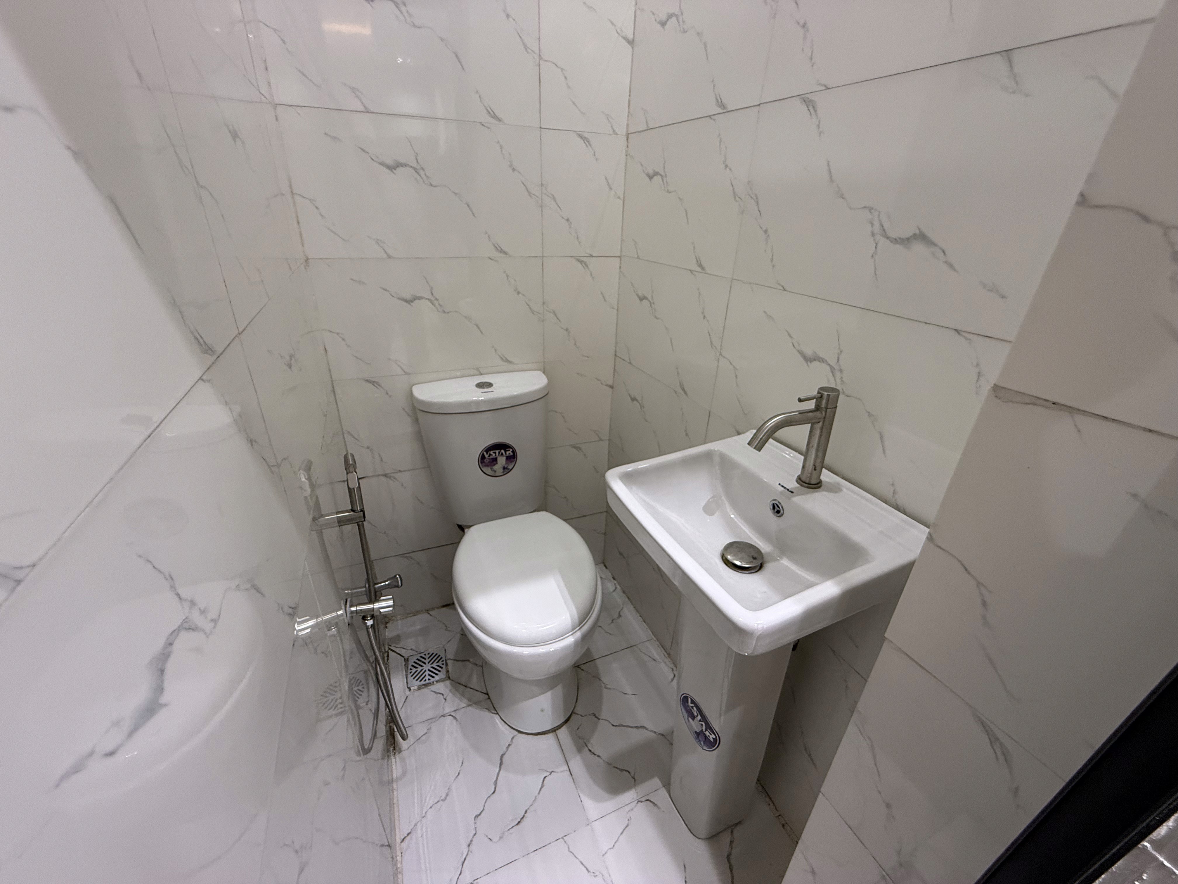 Clean modern bathroom at Olive The Crest, serviced shortlet apartment in Yaba, Lagos