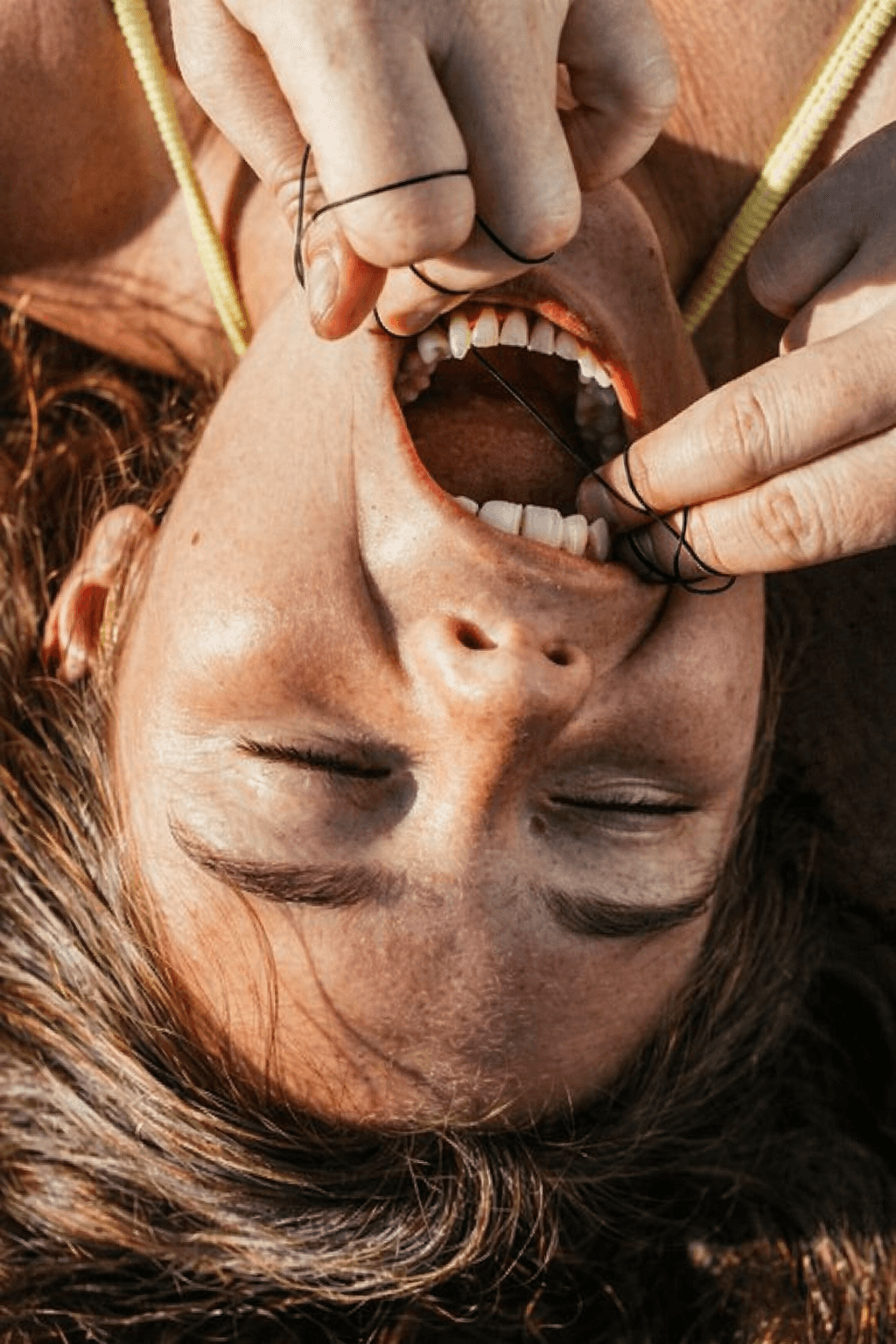 Beautiful woman holding a skin care product