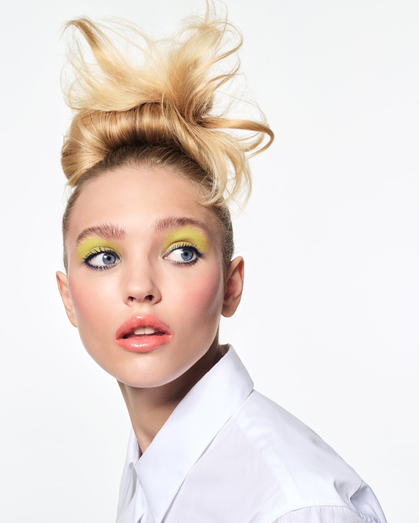 A man stading with Surfboard