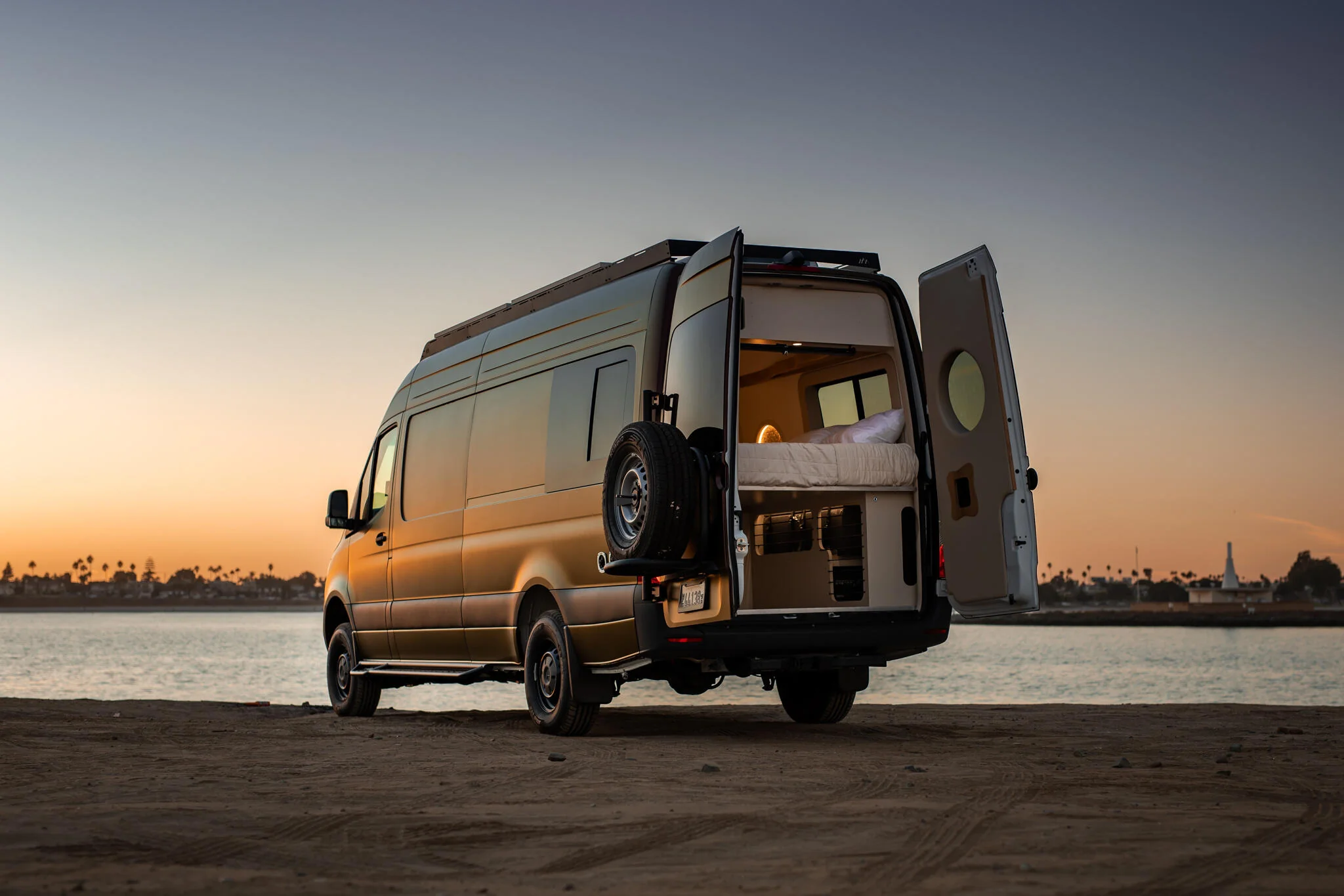Rogue adventure van parked at sunset rear angle