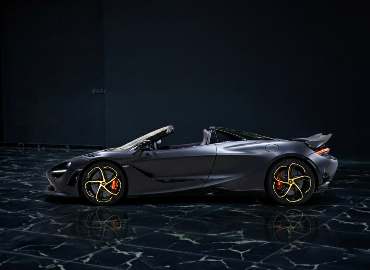 Side view of McLaren 750S Spider showcasing open-top design and performance styling at Queen of Supercar Rental.