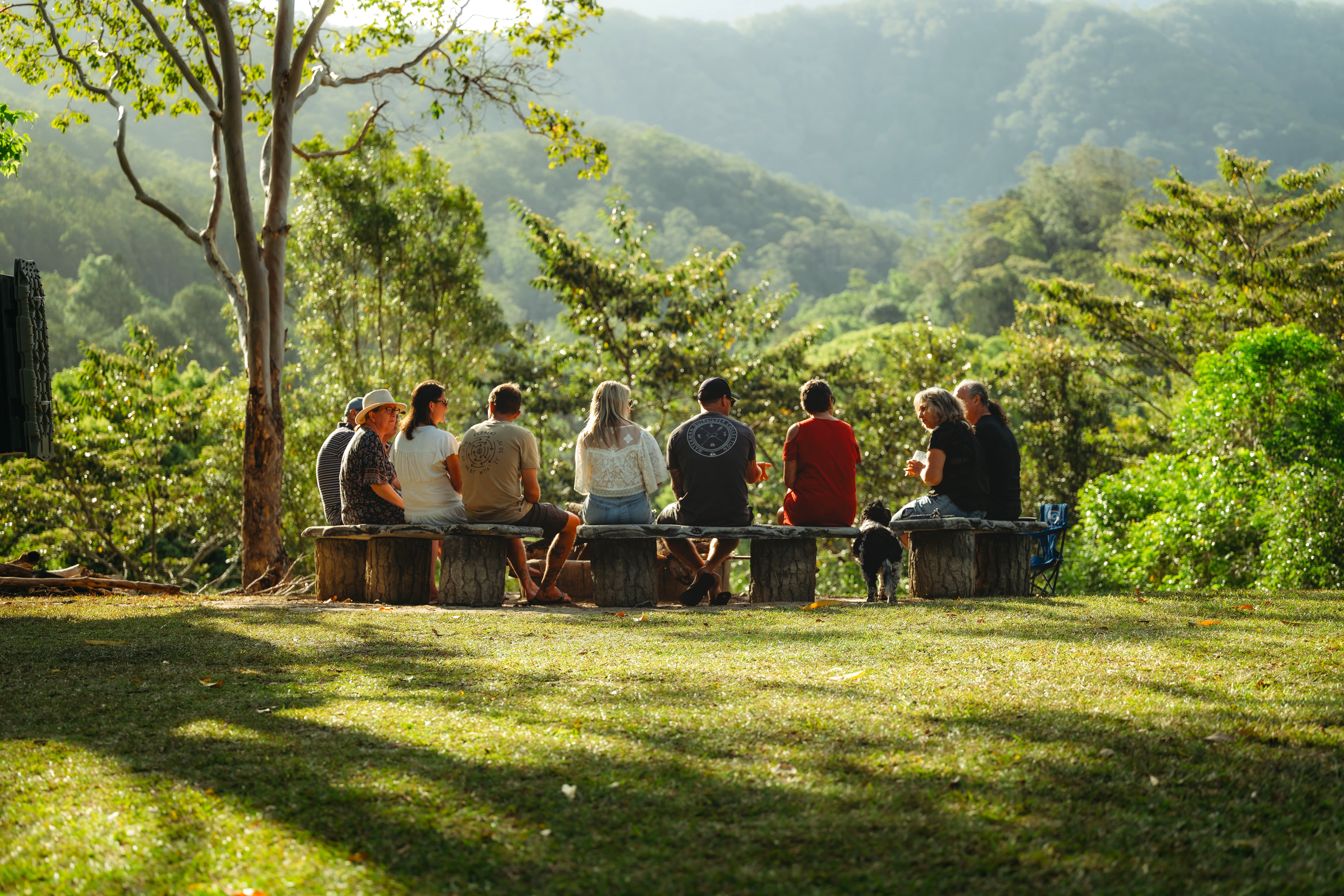 A man stading with Surfboard
