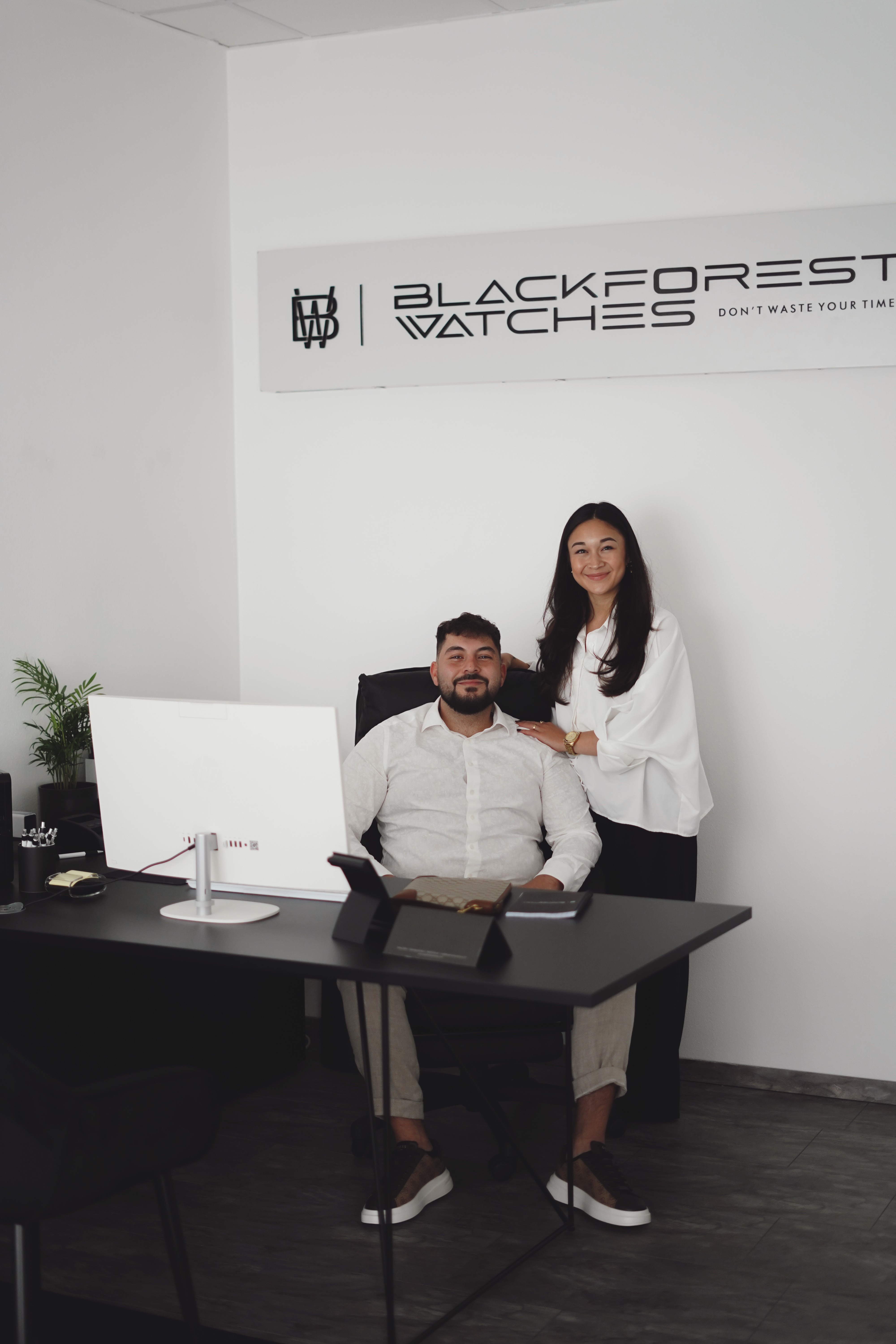 a living room filled with furniture and a kitchen