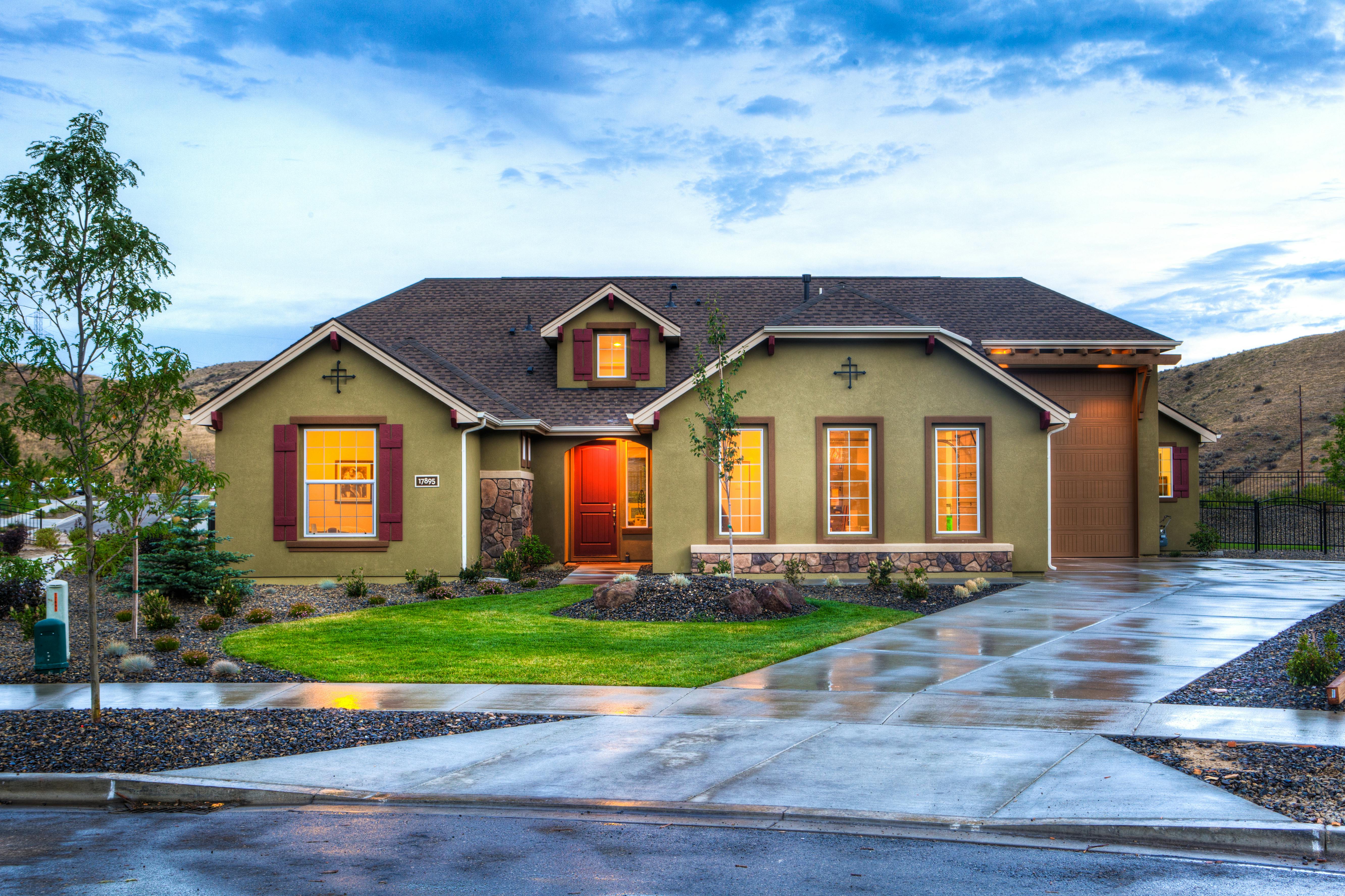 beautifully-illuminated-modern-home-exterior-with-a-lush-lawn-and-wet-driveway-i - binyamin-mellish (pexels)