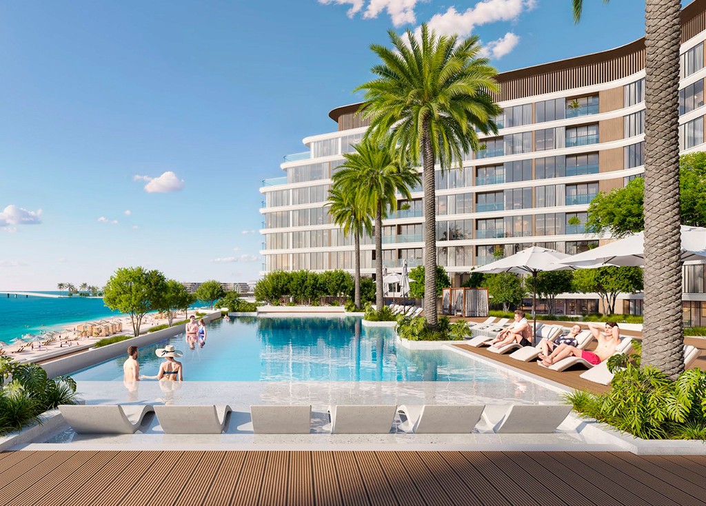 The luxurious Delphine Beach resort in Dubai, featuring a pristine beachfront and inviting sun loungers under palm trees.