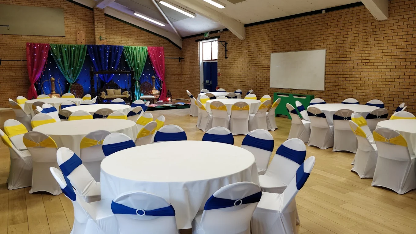 A large hall arranged with tables and chairs
