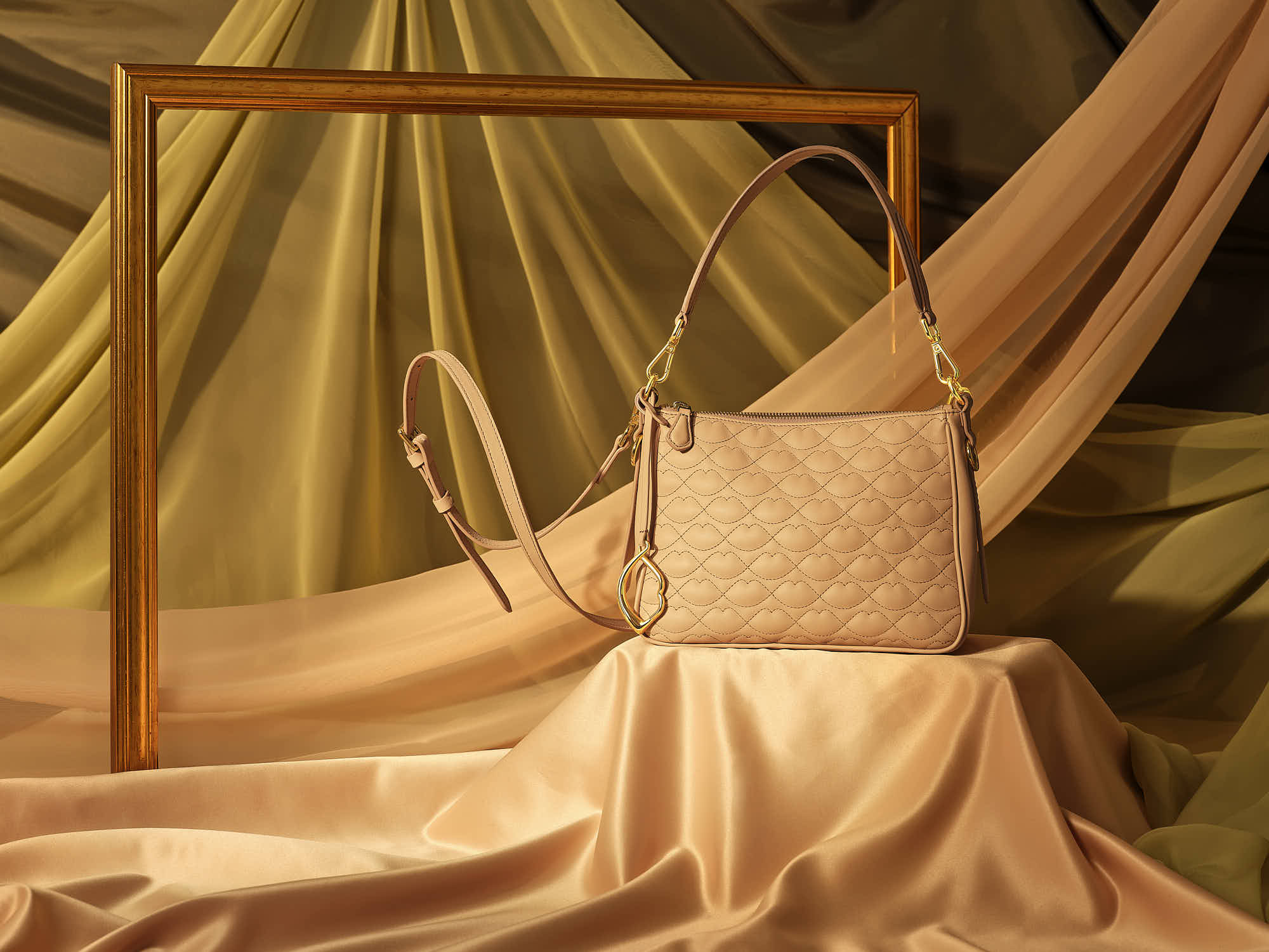 Elegant beige quilted handbag with shoulder strap displayed amid luxurious draped fabric and wooden frame backdrop.