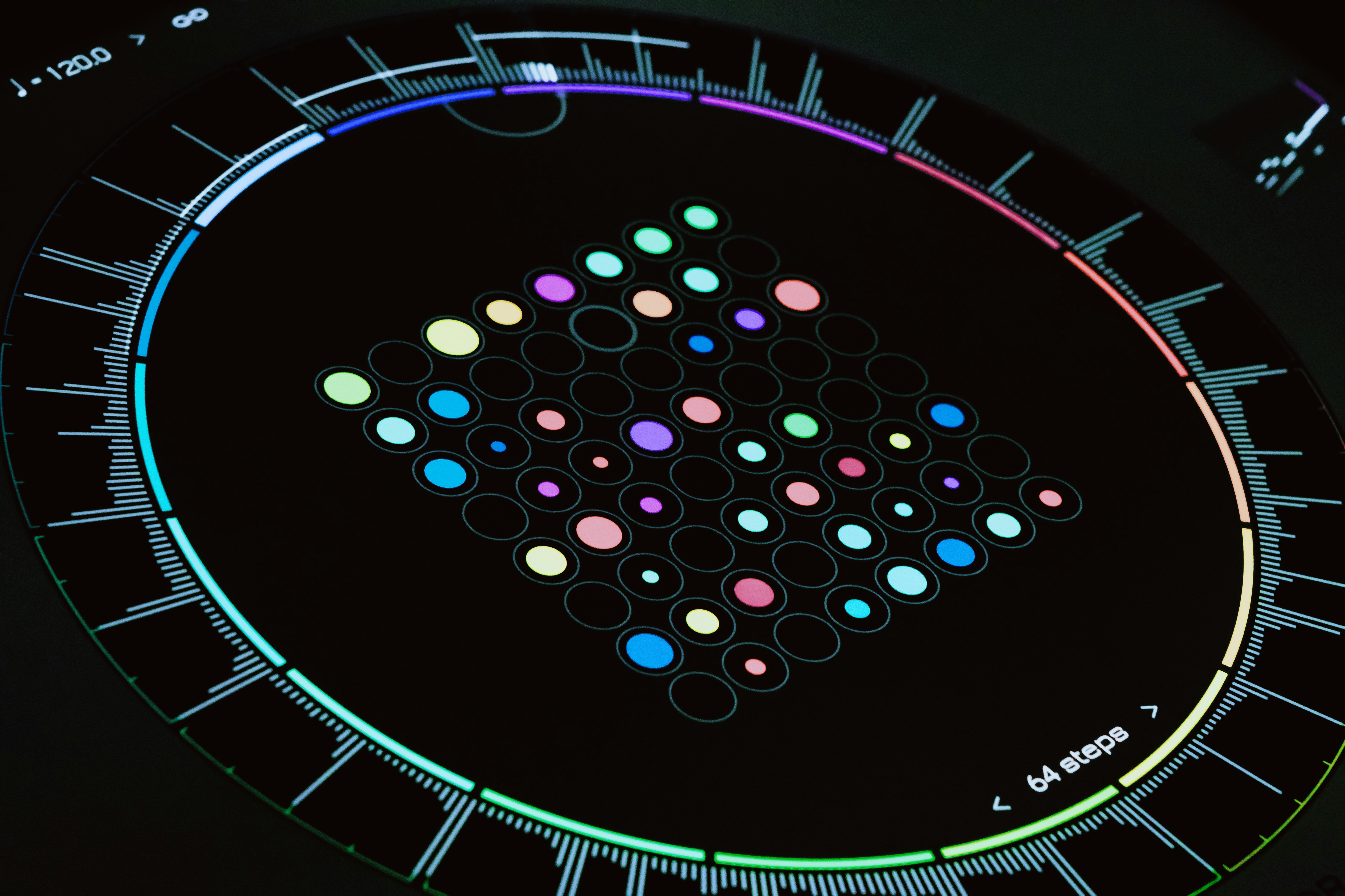 A close up of a clock on a black surface