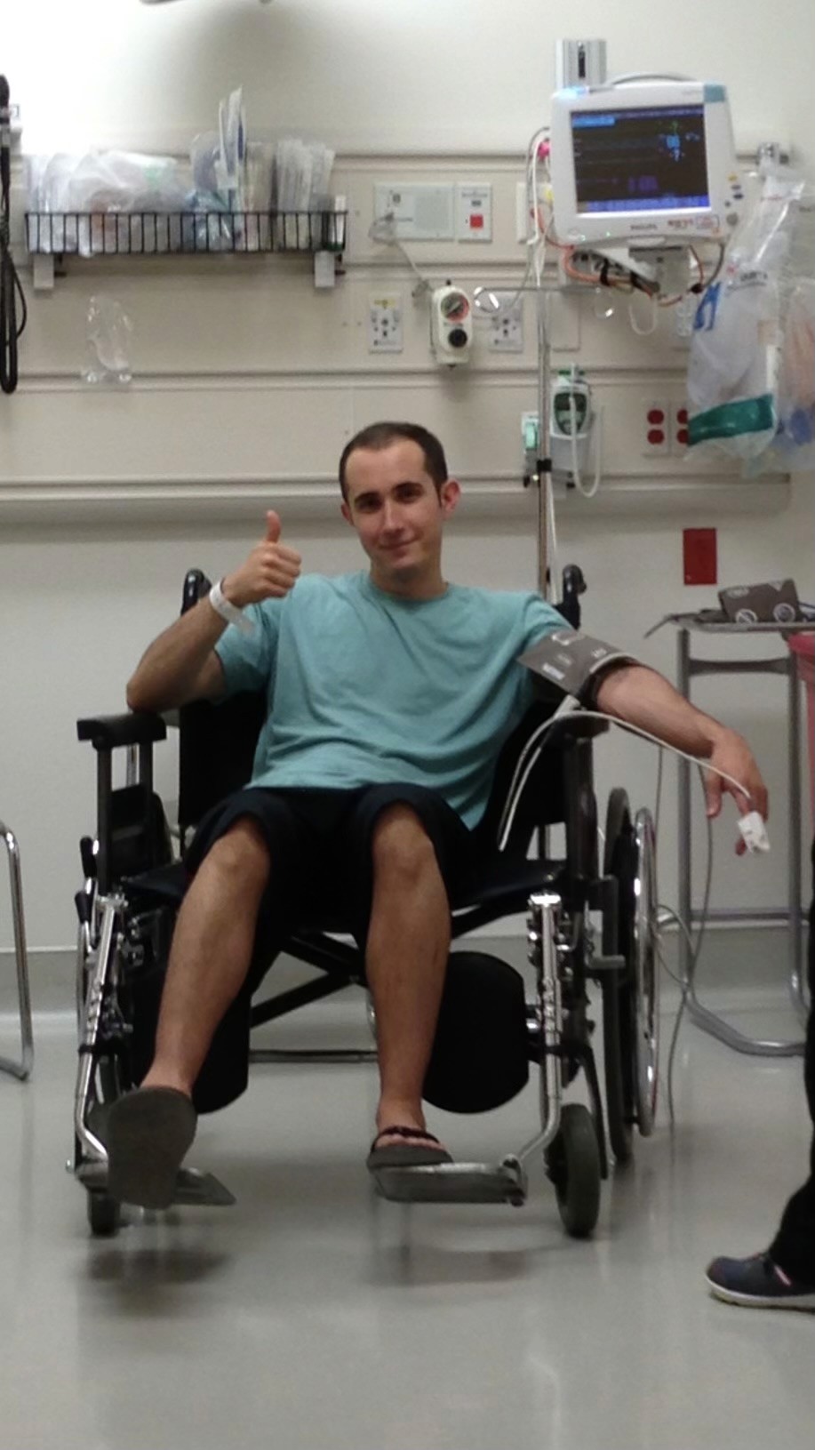 Michael in a hospital wheelchair during a severe period of illness
