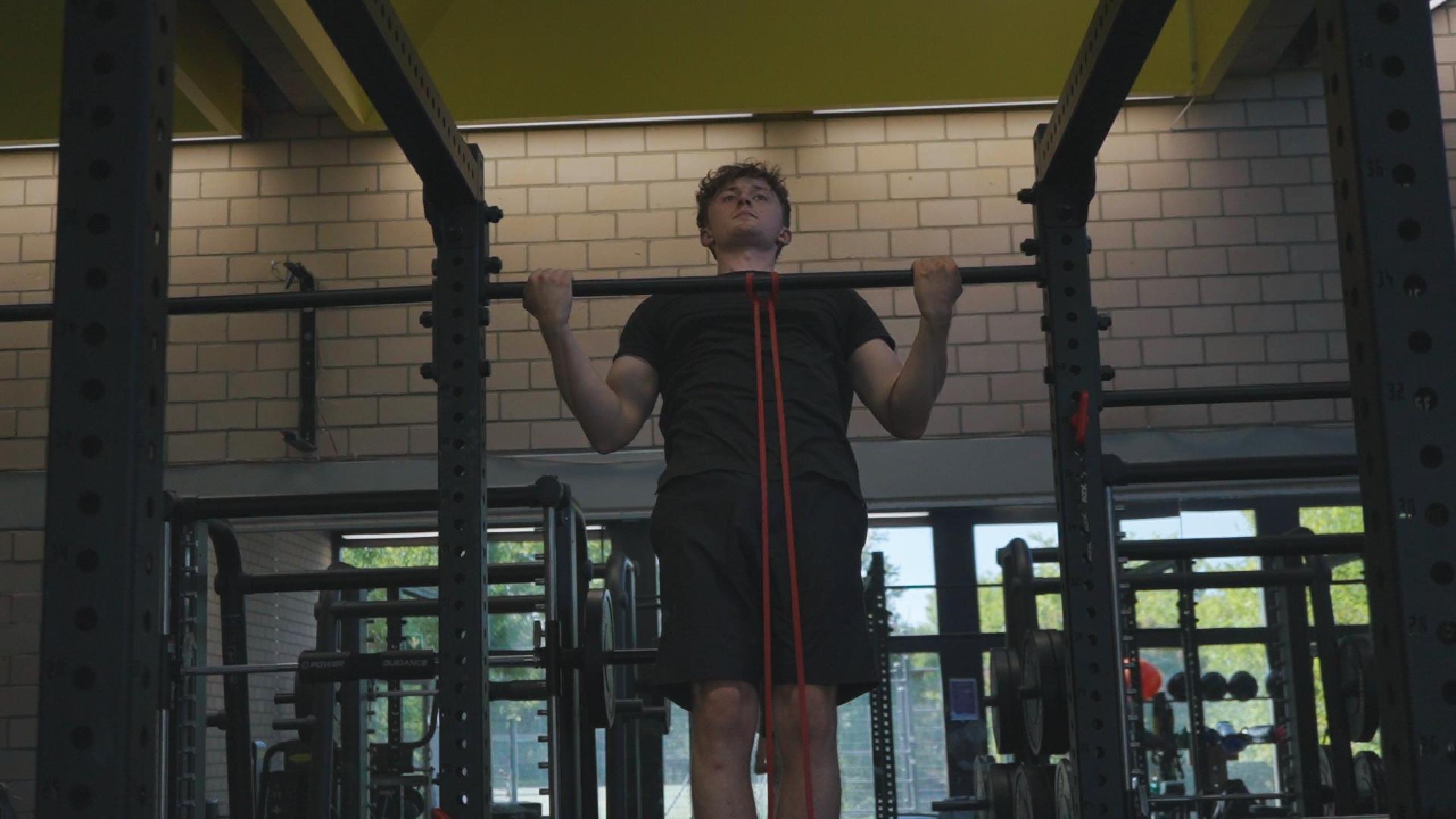 Assisted Wide Grip Chin Up