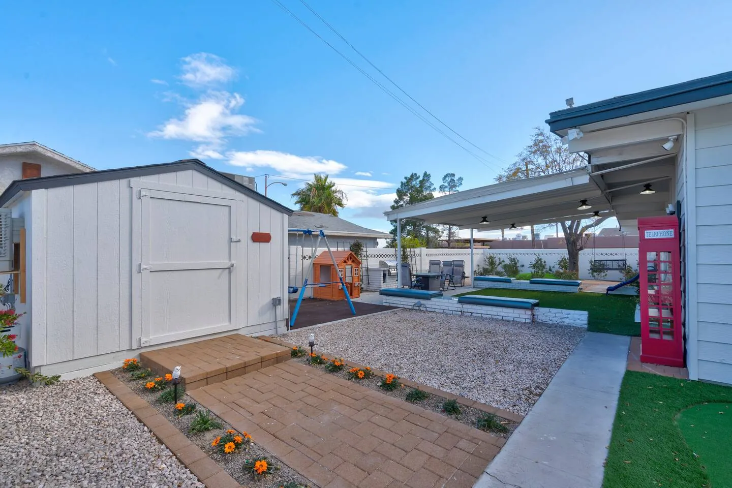 Backyard with turf, a patio and the storage shed, Wizard’s Dream in North Las Vegas