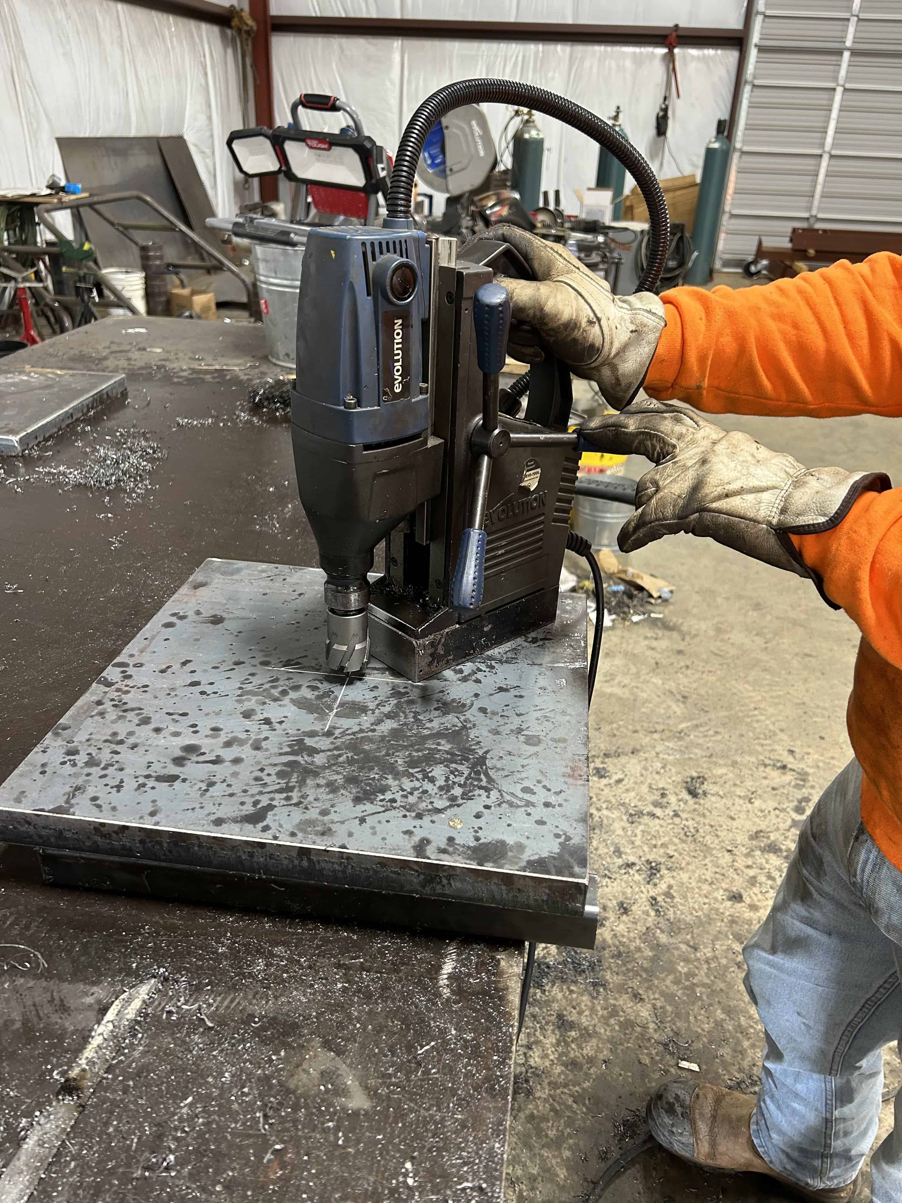 The Evolution mag drill creating 2" diameter holes in custom thick steel plates for a client in Henderson, Texas.