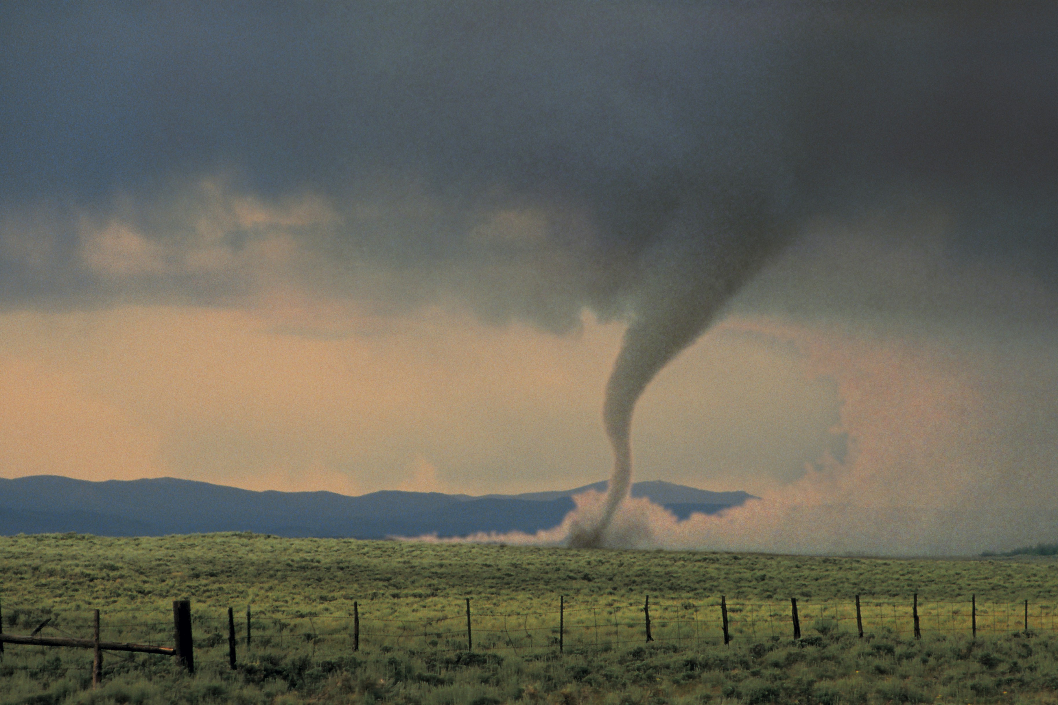 tornado moves across farmland