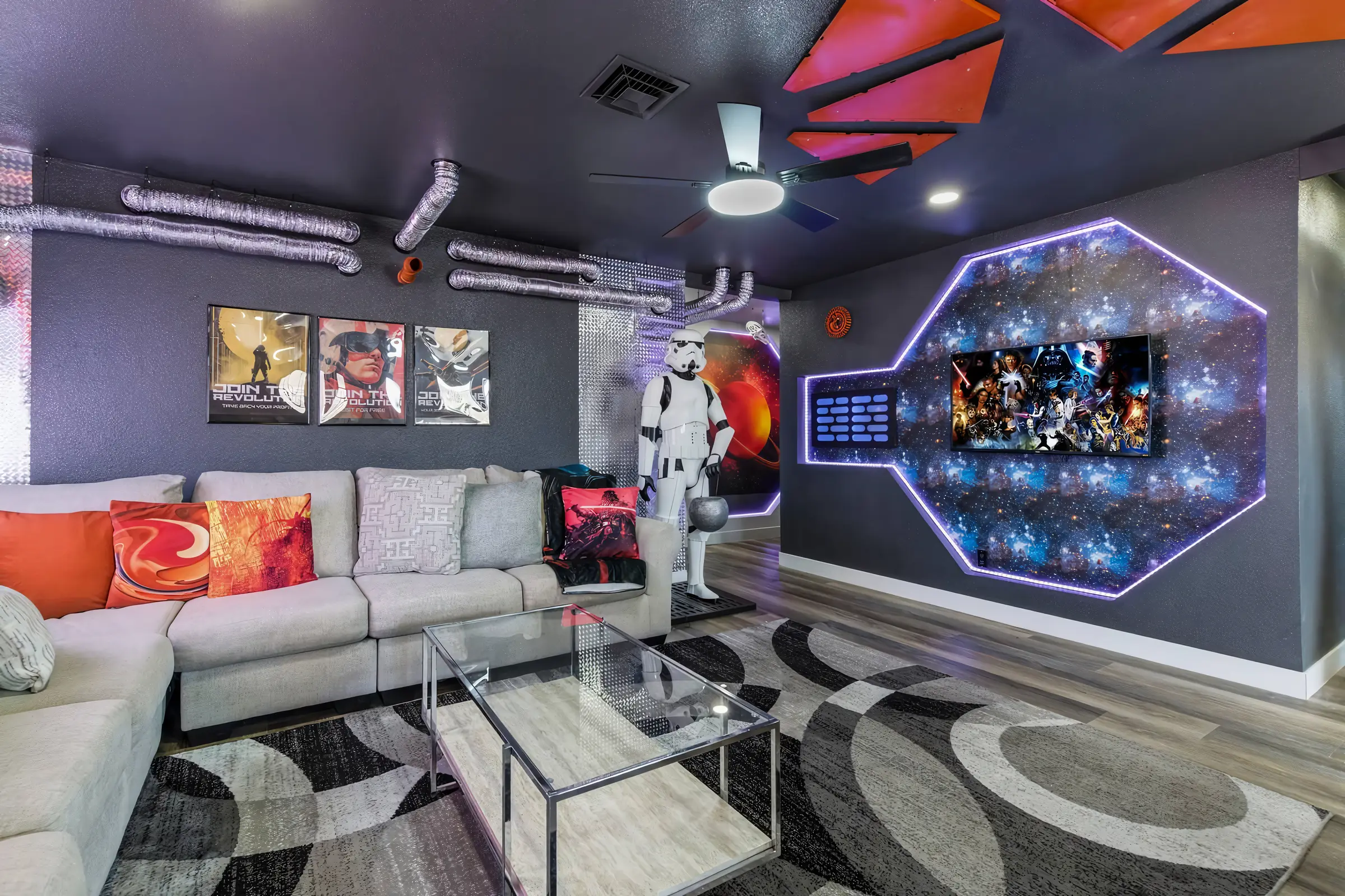 Living room with a sectional, trooper figure and lit galaxy wall display, Star Wars Getaway in North Las Vegas