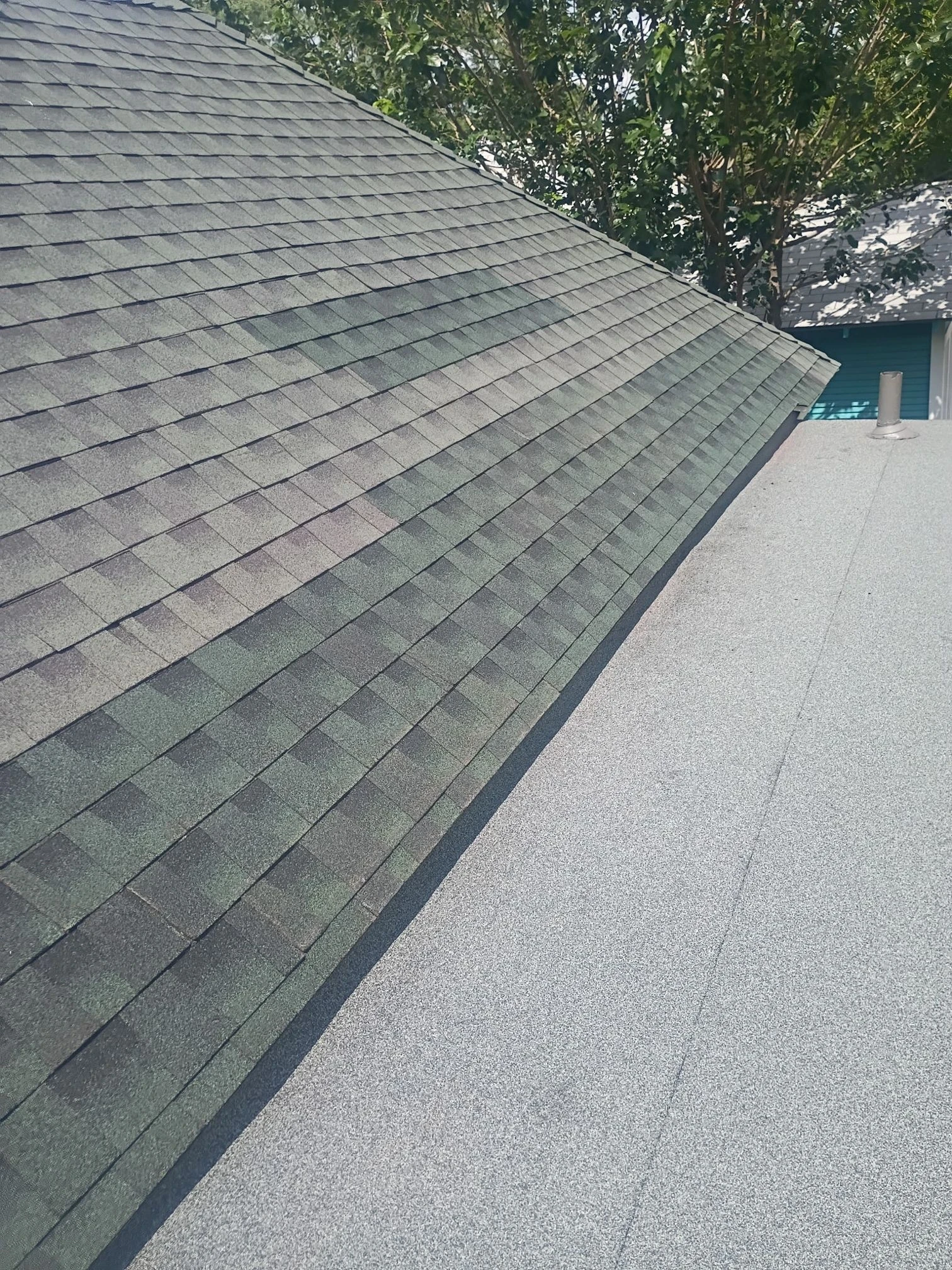 Finished repair: low-slope roof transition rebuilt in San Antonio, Texas.